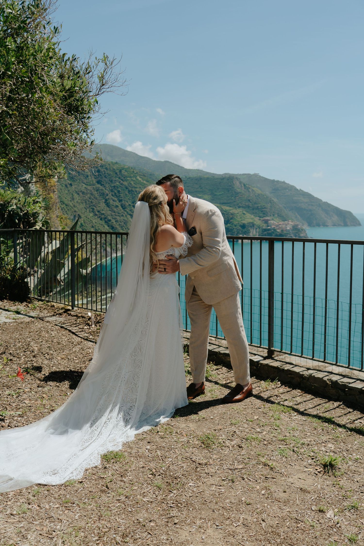 Seaside Italian wedding ceremony with stunning coastal views and flowing white dress.