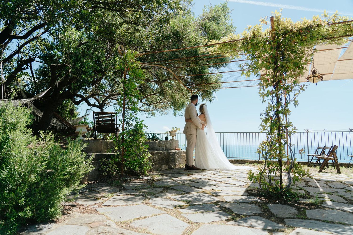A panoramic sequence of Mediterranean coastal views with trees, stone walls, and blue ocean waters under sunny skies.