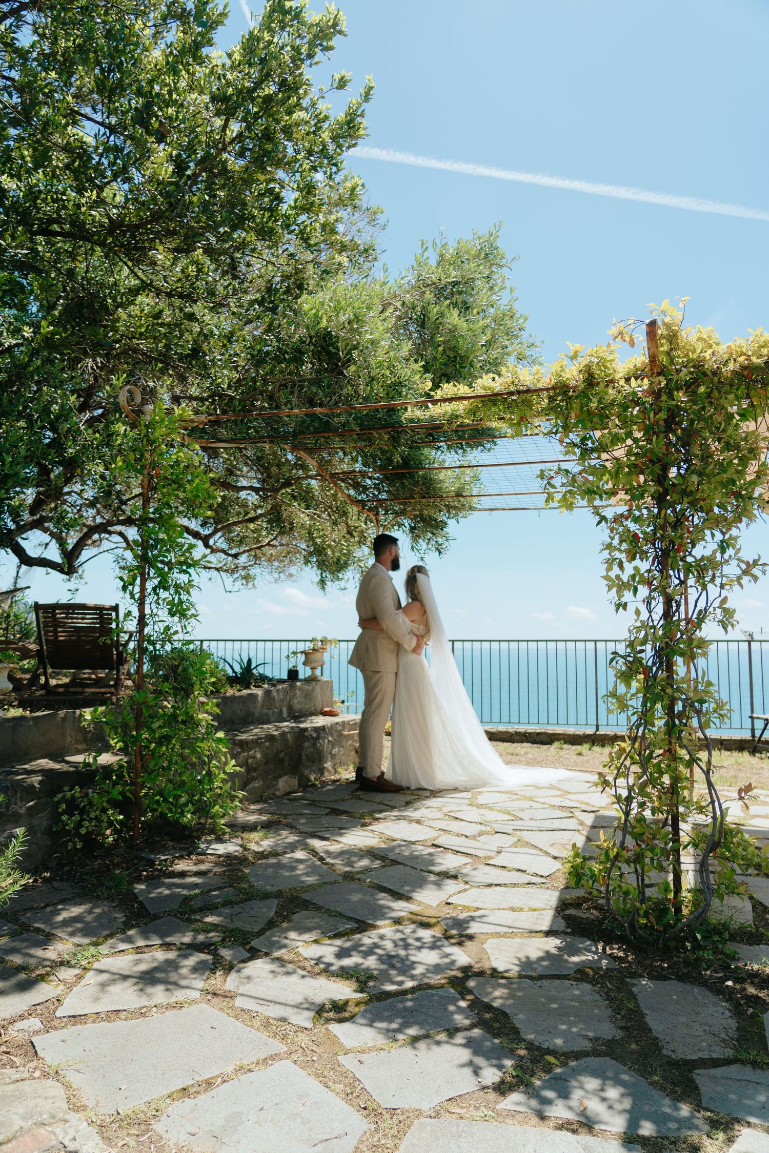 Garden wedding venue with stone pathways and natural greenery overlooking the ocean in Cinque Terre Italy