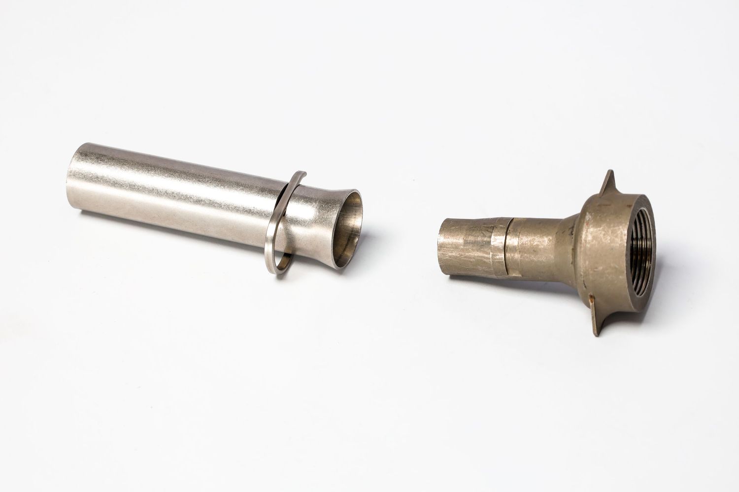 Two metal mechanical parts or fittings shown side by side against a white background.