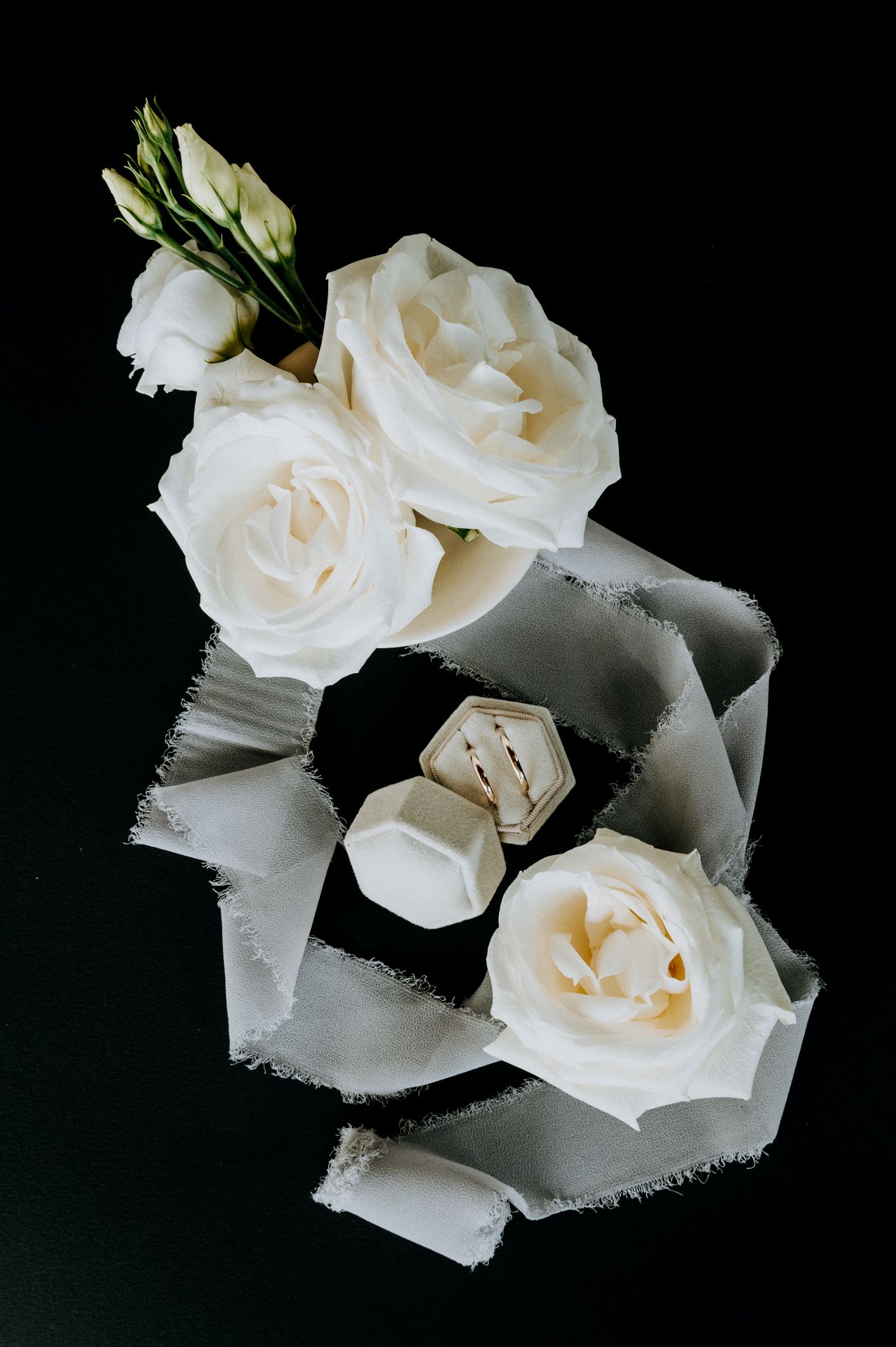 flatlay with flowers and the wedding rings