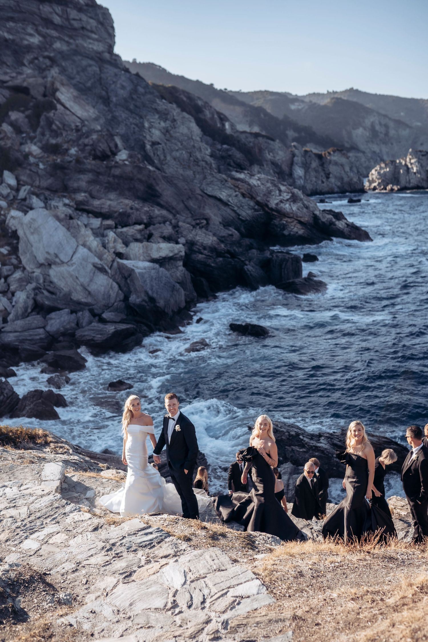 bride, groom and guests on a seaside cliff at Skopelos Island