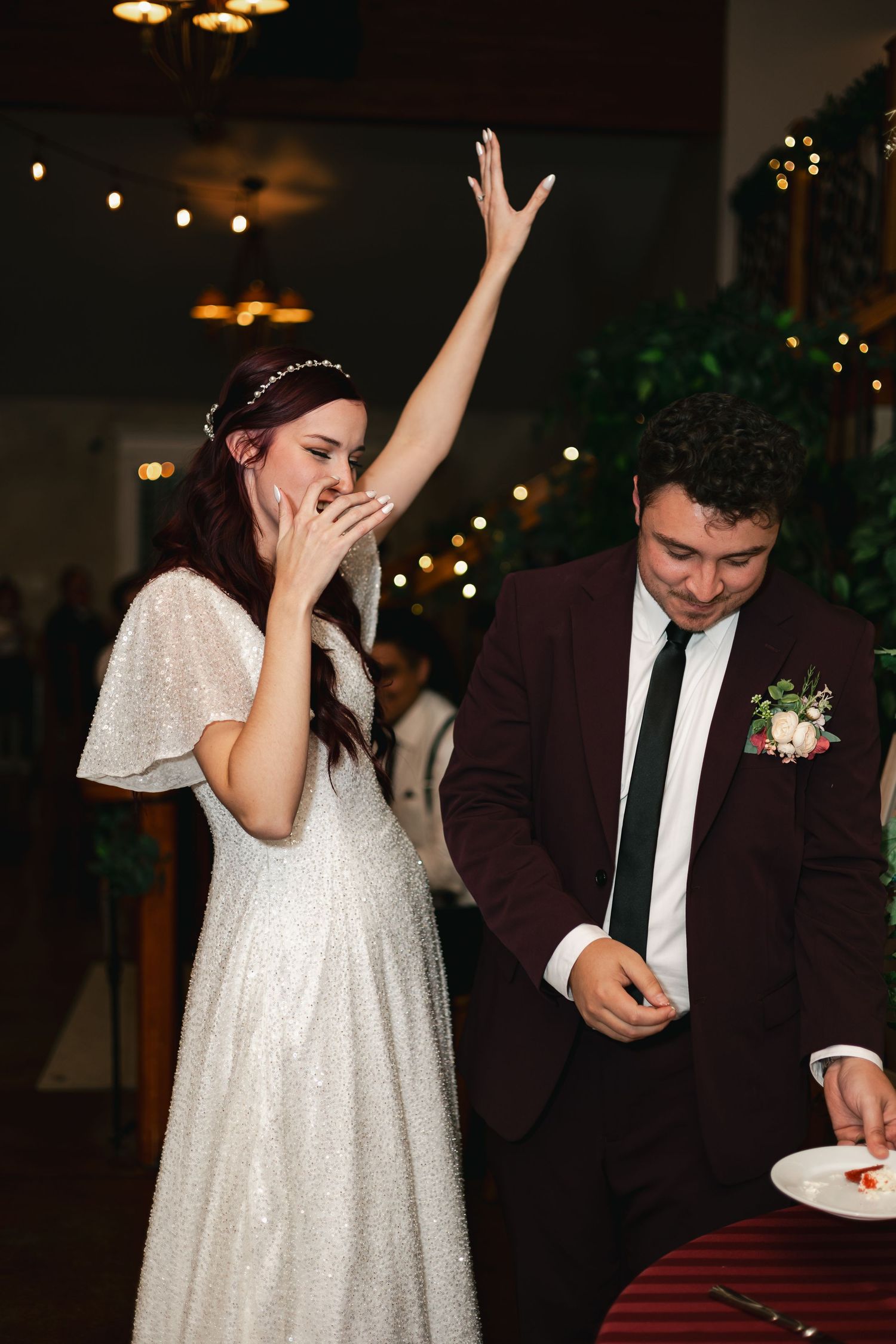Wedding reception dance floor moments with couple in sparkly dress and dark suit.