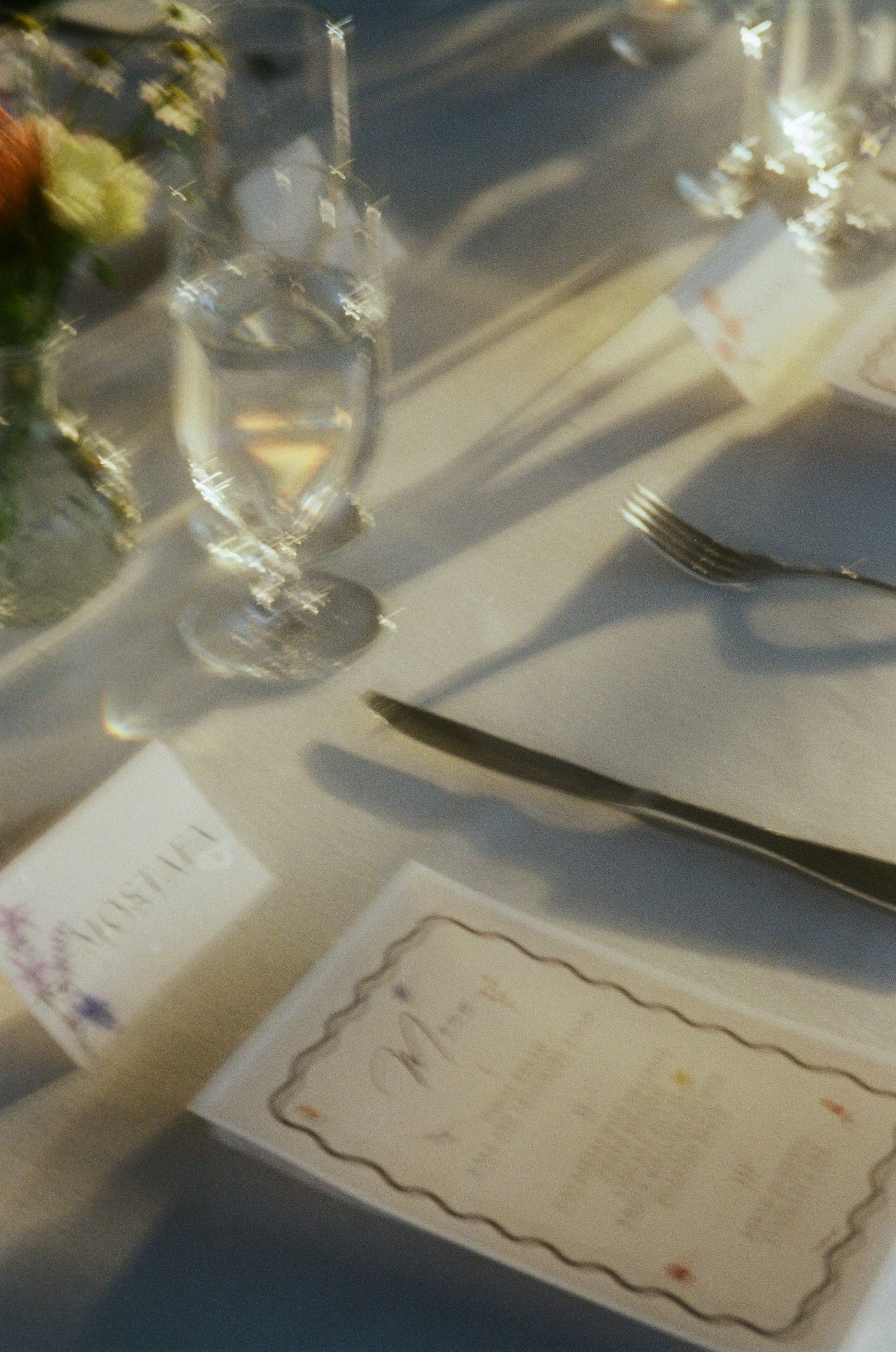 Elegant place settings with menu cards on a formal dining table.