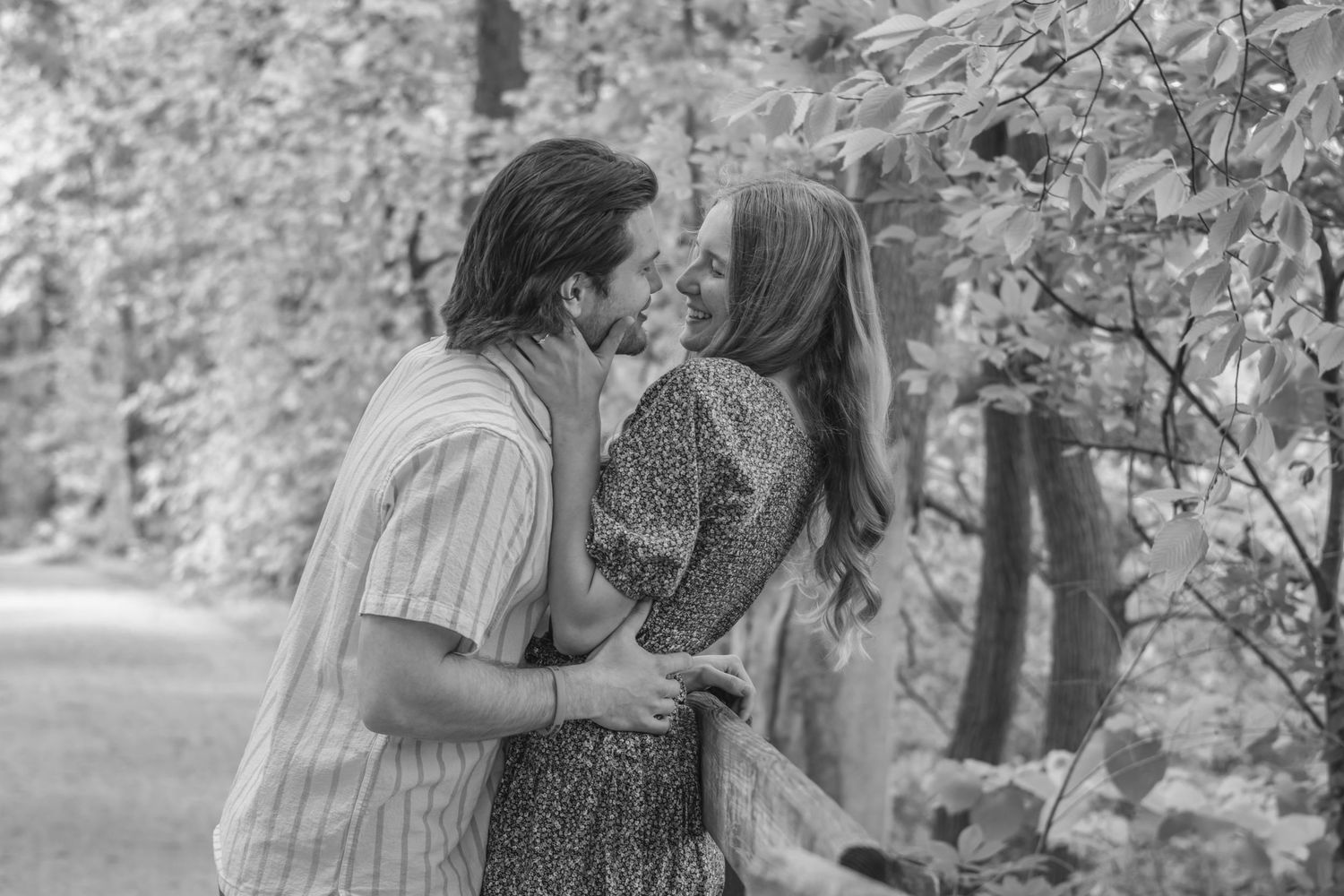 A romantic couple share tender moments together outdoors