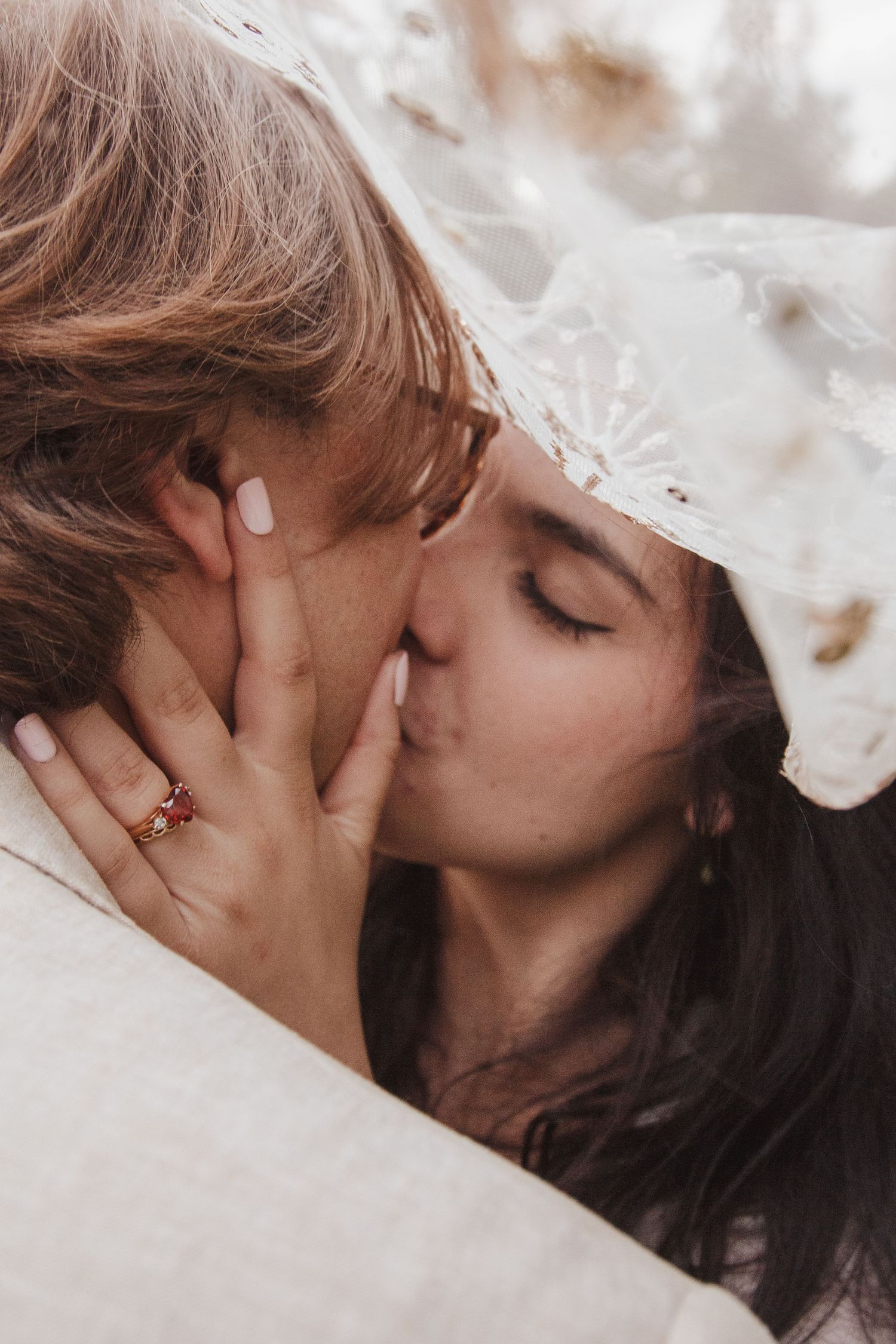 A romantic couple sharing an intimate kiss in a series of connected photos showing different angles.