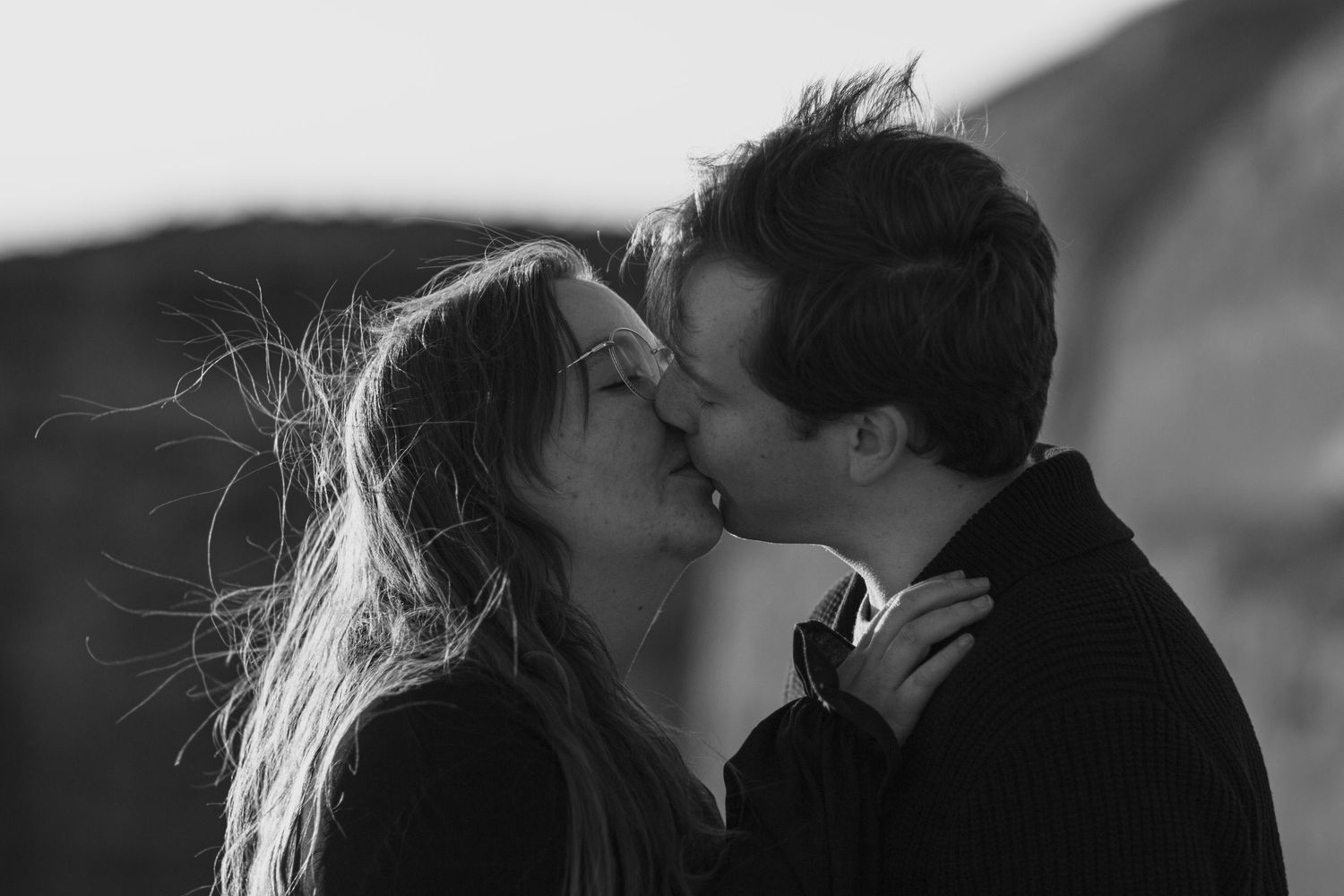 A romantic couple shares intimate black and white moments in a photo series.