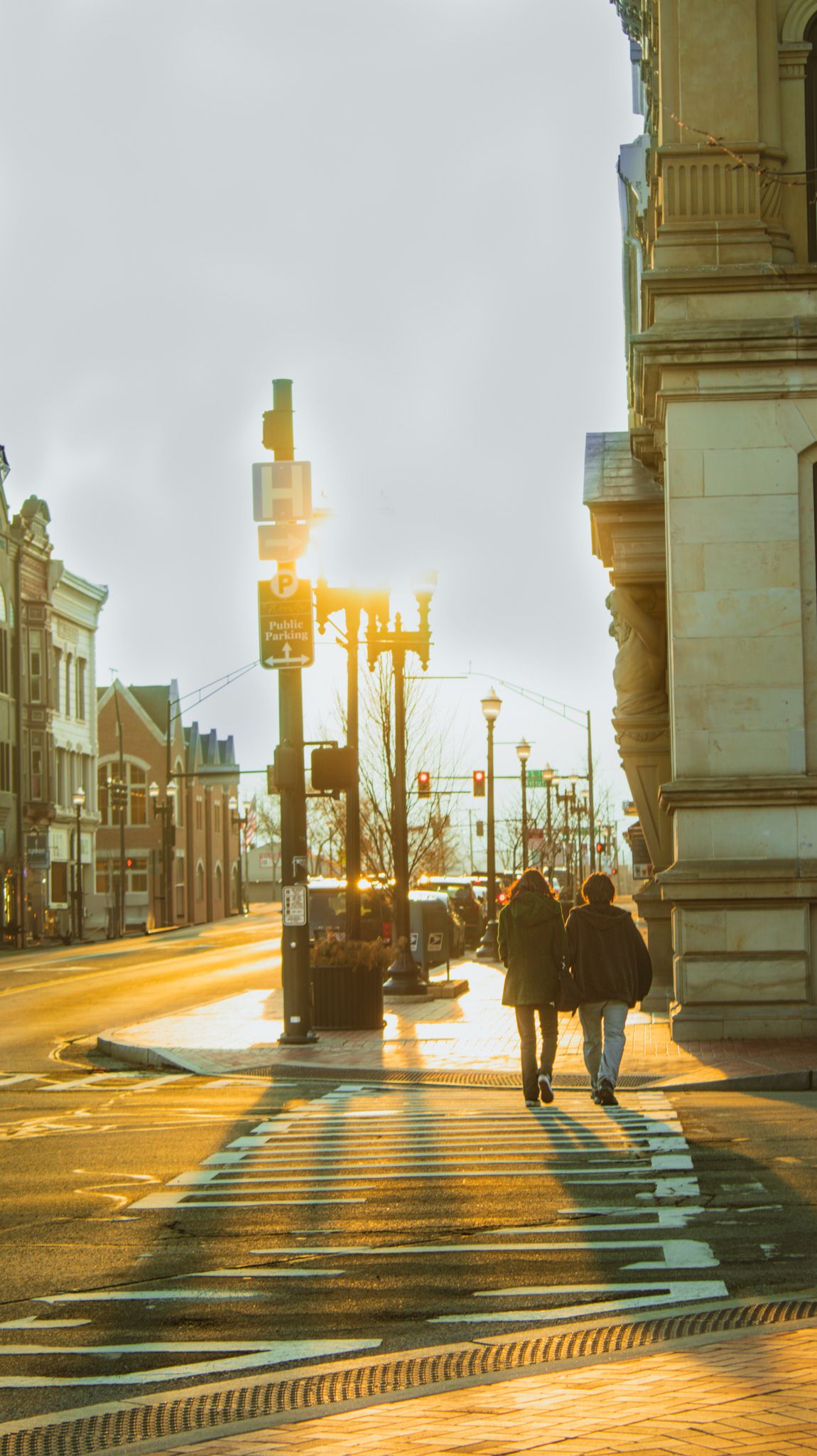 A sunset with people walking