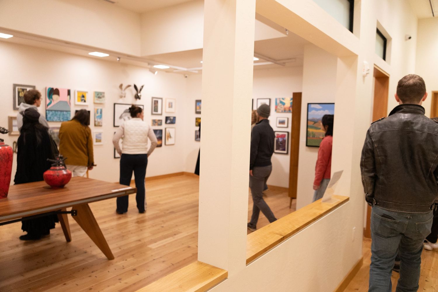 Background image of Missoula, Montana's downtown art scene at night on First Friday.