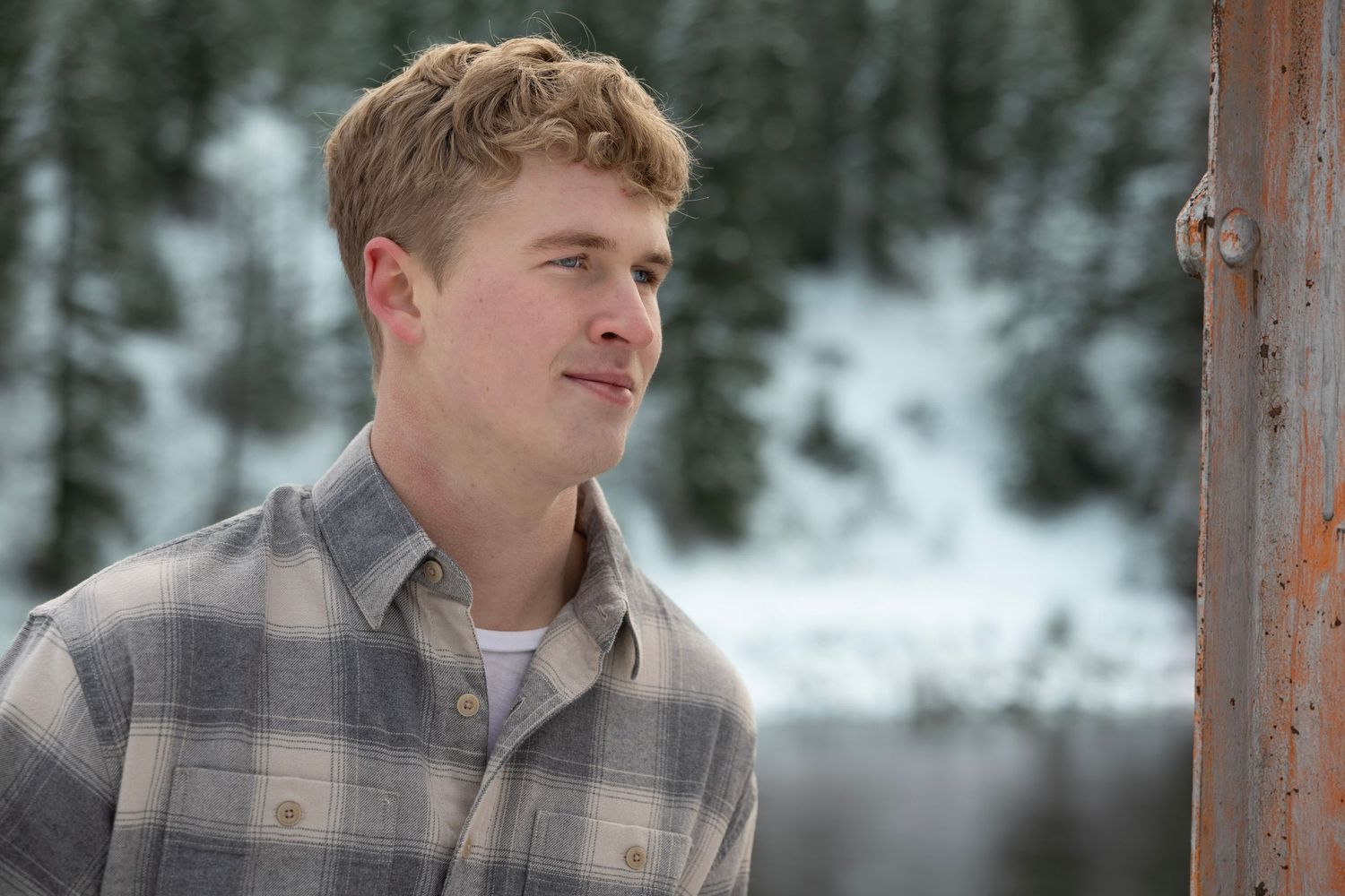 Superior High School senior boy portrait, with a snowy backdrop at the Lozeau, Mt bridge.
