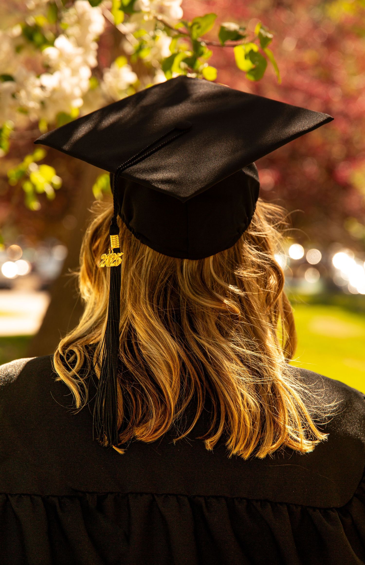 Missoula, Mt University Graduate Senior Portrait, outside wearing cap and gown
Kayla Sproles Photography 2025