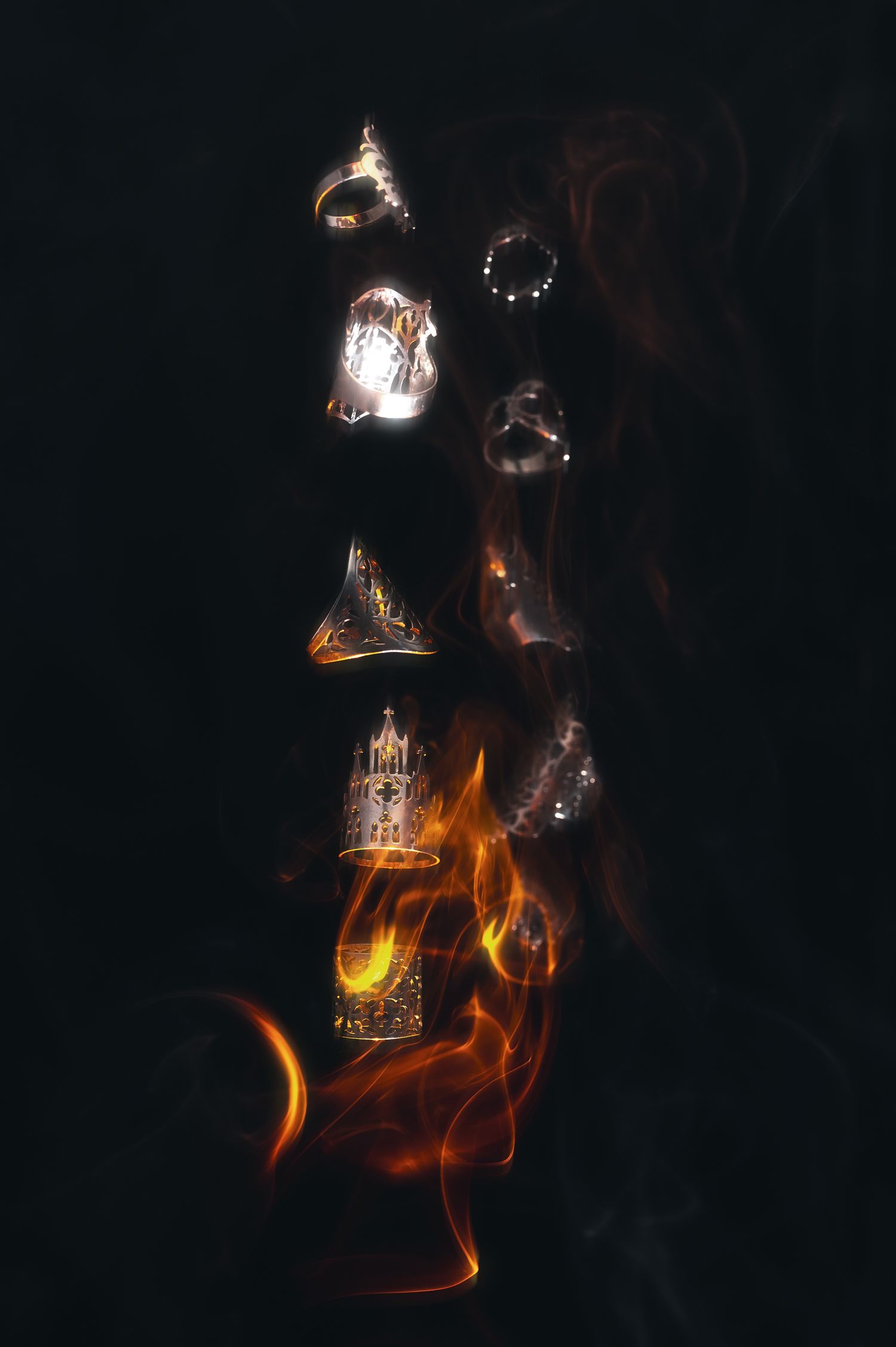 Abstract long exposure photography of fire and light trails against dark background.