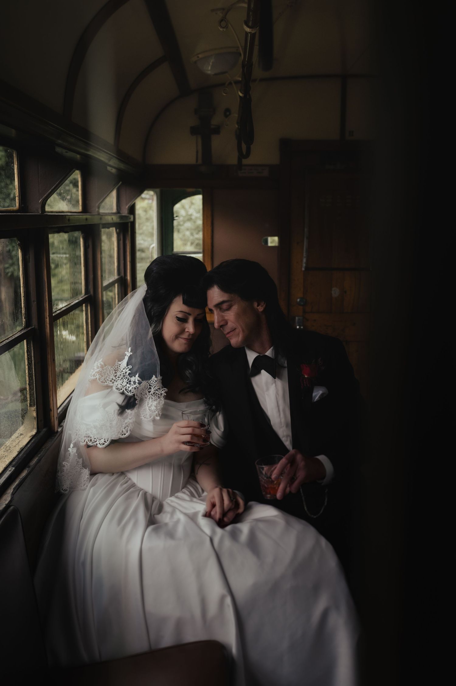 A romantic sequence of wedding photos showing a couple sharing intimate moments in a vintage train car.