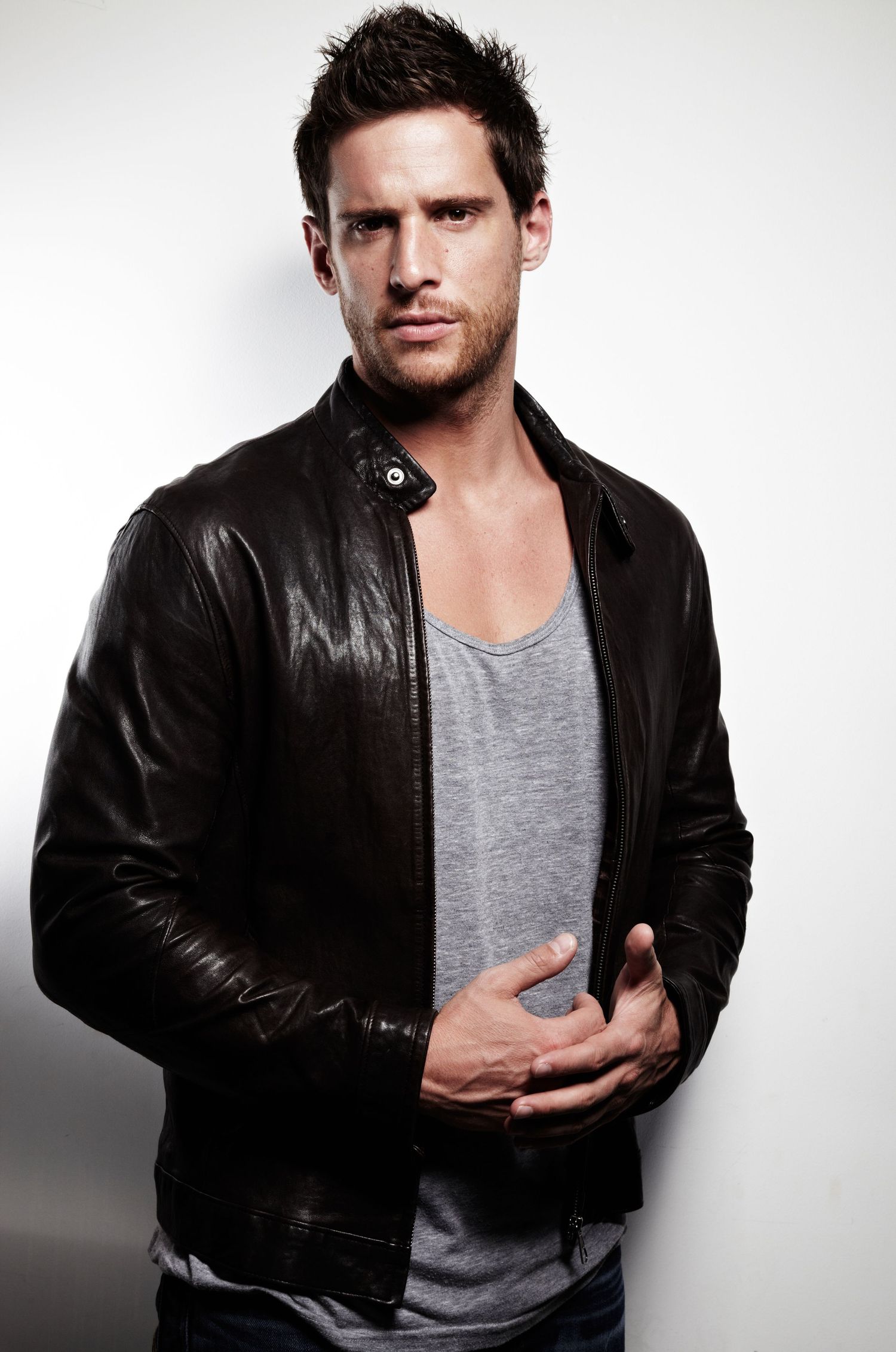 A dramatic portrait series featuring someone in a leather jacket and grey shirt against white.