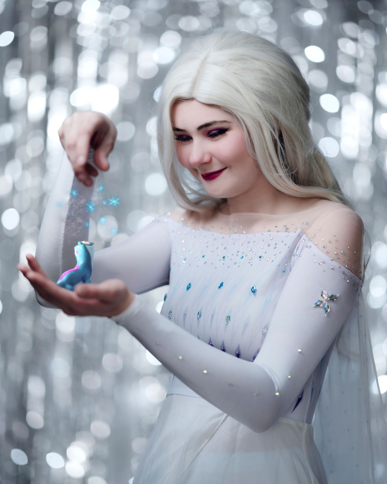 Fantasy portrait with sparkly bokeh lights and ethereal winter theme.