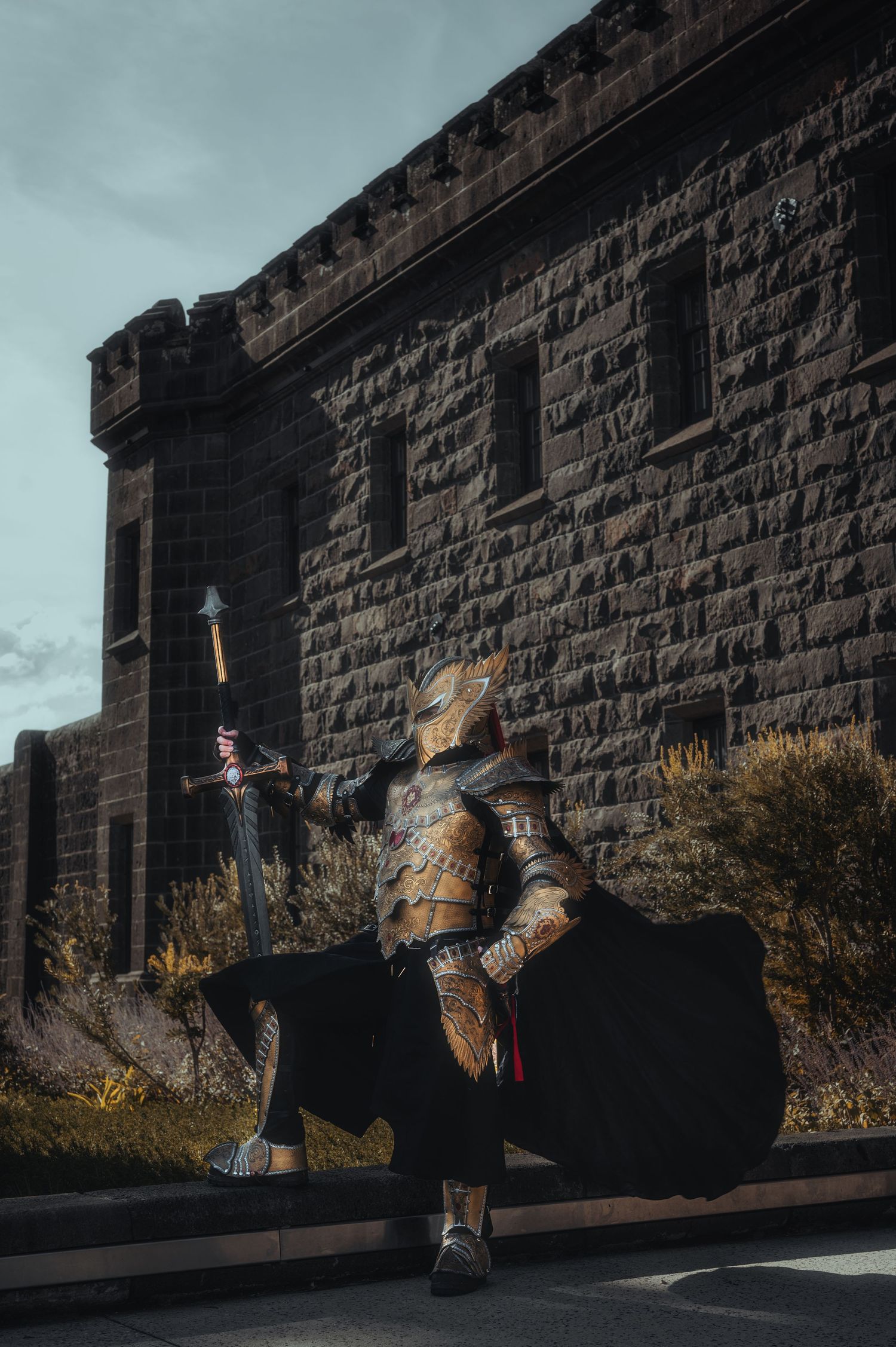 Medieval combat sequence showing dramatic sword fighting moves against castle walls.