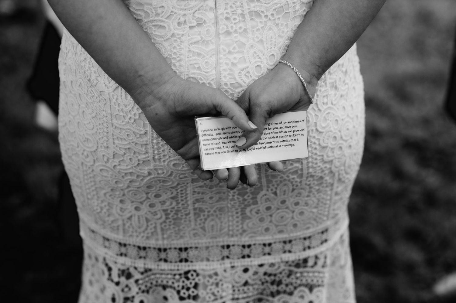 Close-up detail of intricate lace pattern on a wedding dress bodice.