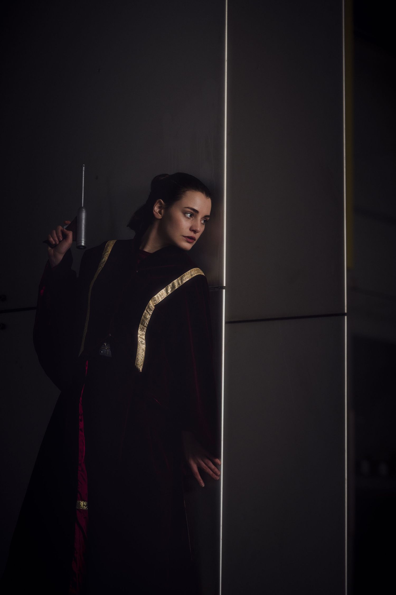 Artistic low-key portrait with minimalist lighting and dark atmosphere.