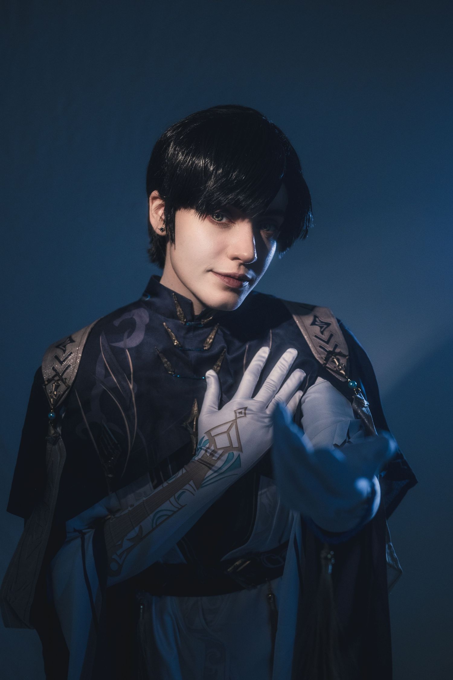 Artistic portrait showing dramatic poses with white gloves against dark background.