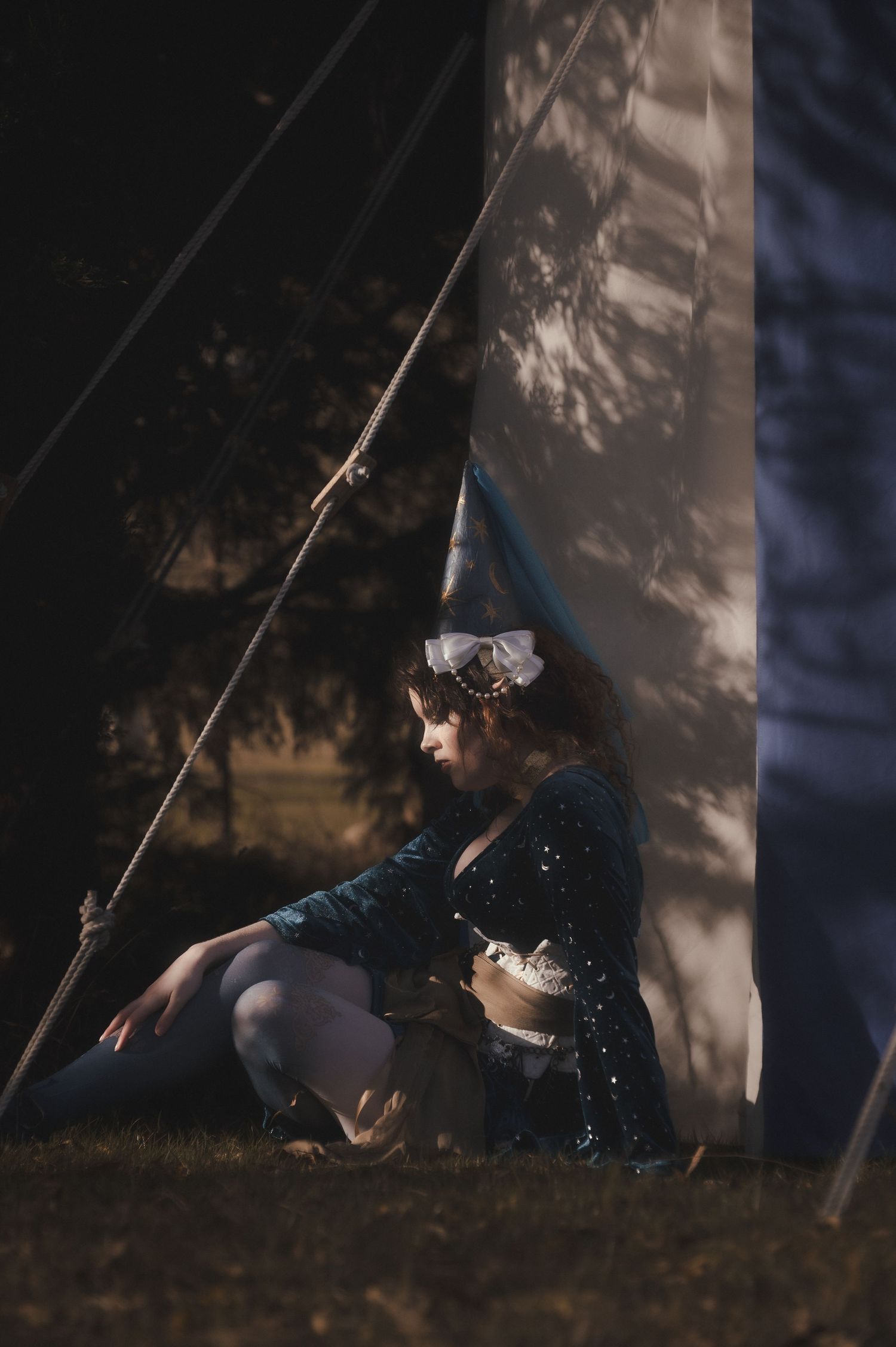 Artistic silhouette photo sequence of person swinging on rope in moody lighting.