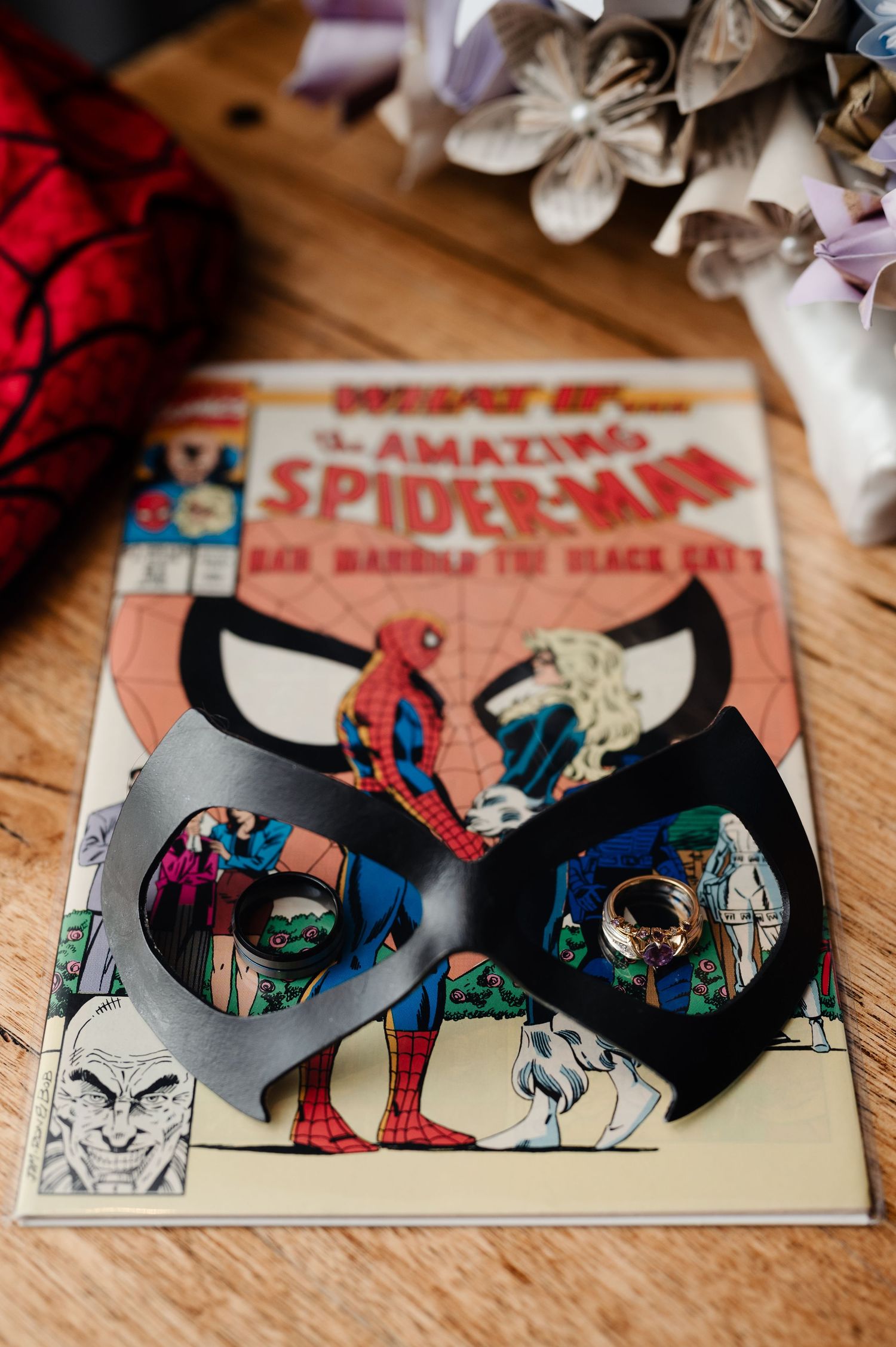 Vintage Spider-Man comic books arranged artistically on a wooden surface.