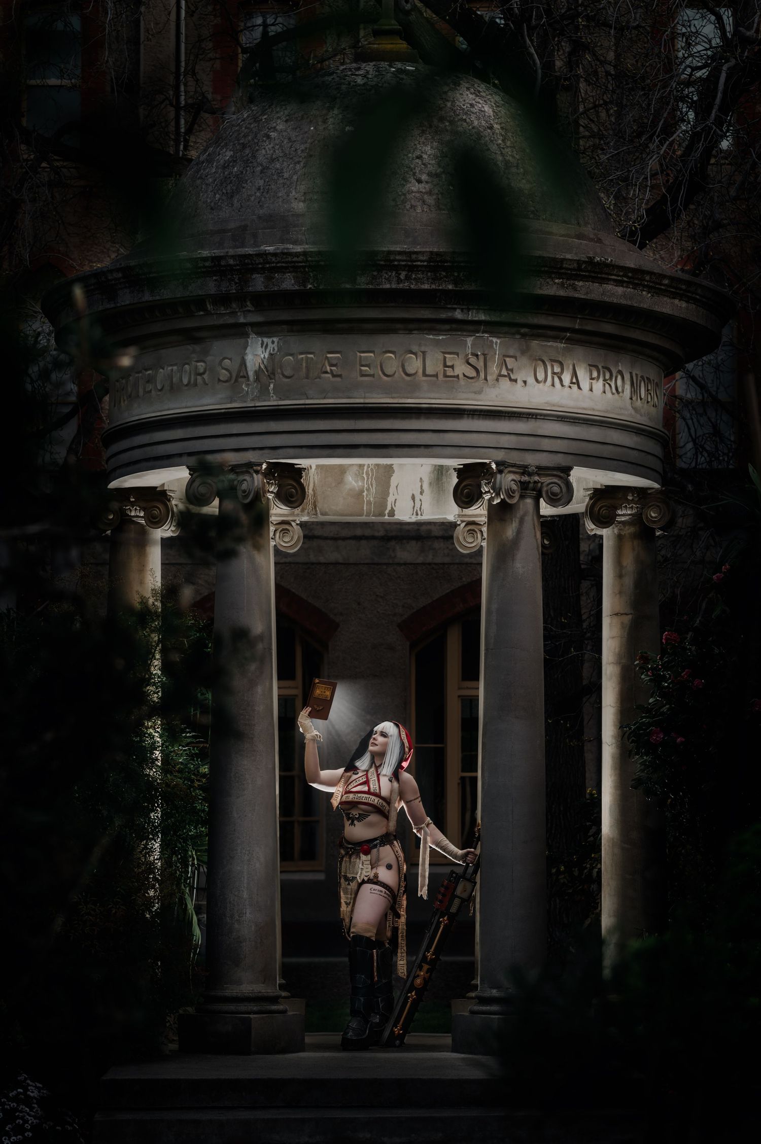 Atmospheric night photography session at a historic stone church entrance.