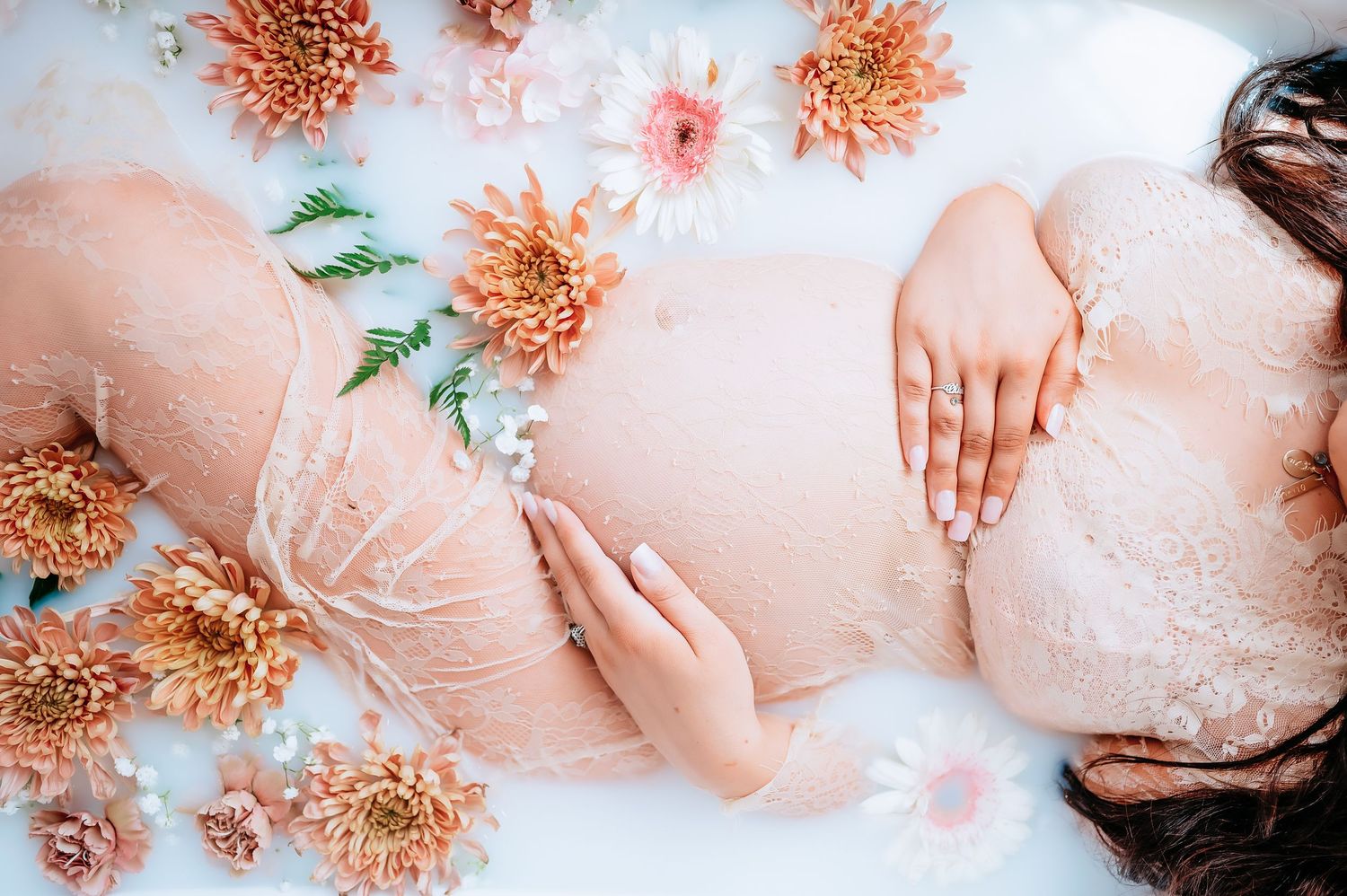 Aesthetic pink abstract composition with dried coral-colored flowers and soft peachy tones creating a delicate artistic layout.