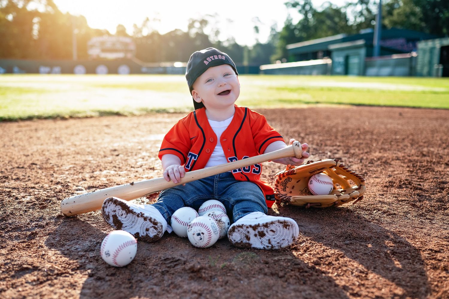 A series of baseball-themed photos with baseballs, gloves, and red jersey on a dirt baseball diamond at sunset.