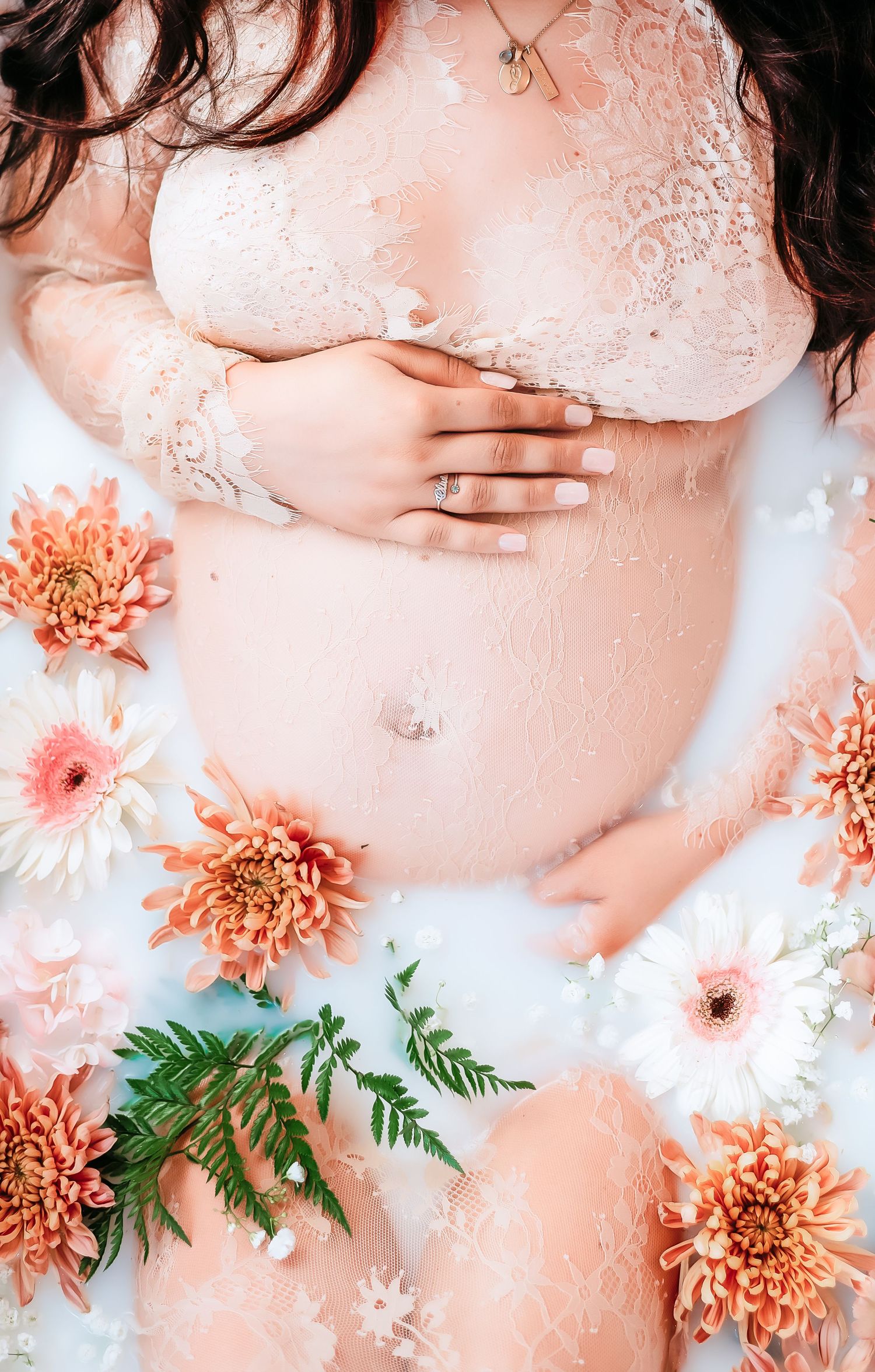 Dreamy feminine photography composition with soft peach tones featuring chrysanthemum flowers and gentle fabric draping.