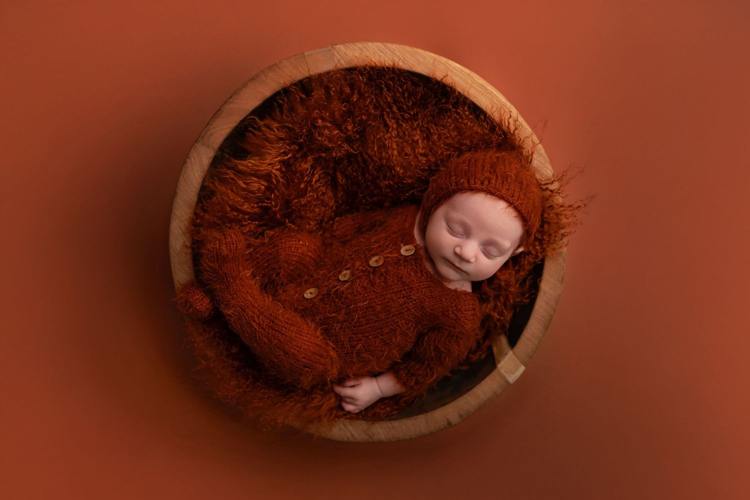 Chocolate truffles and cocoa powder arranged in a warm brown toned composition.