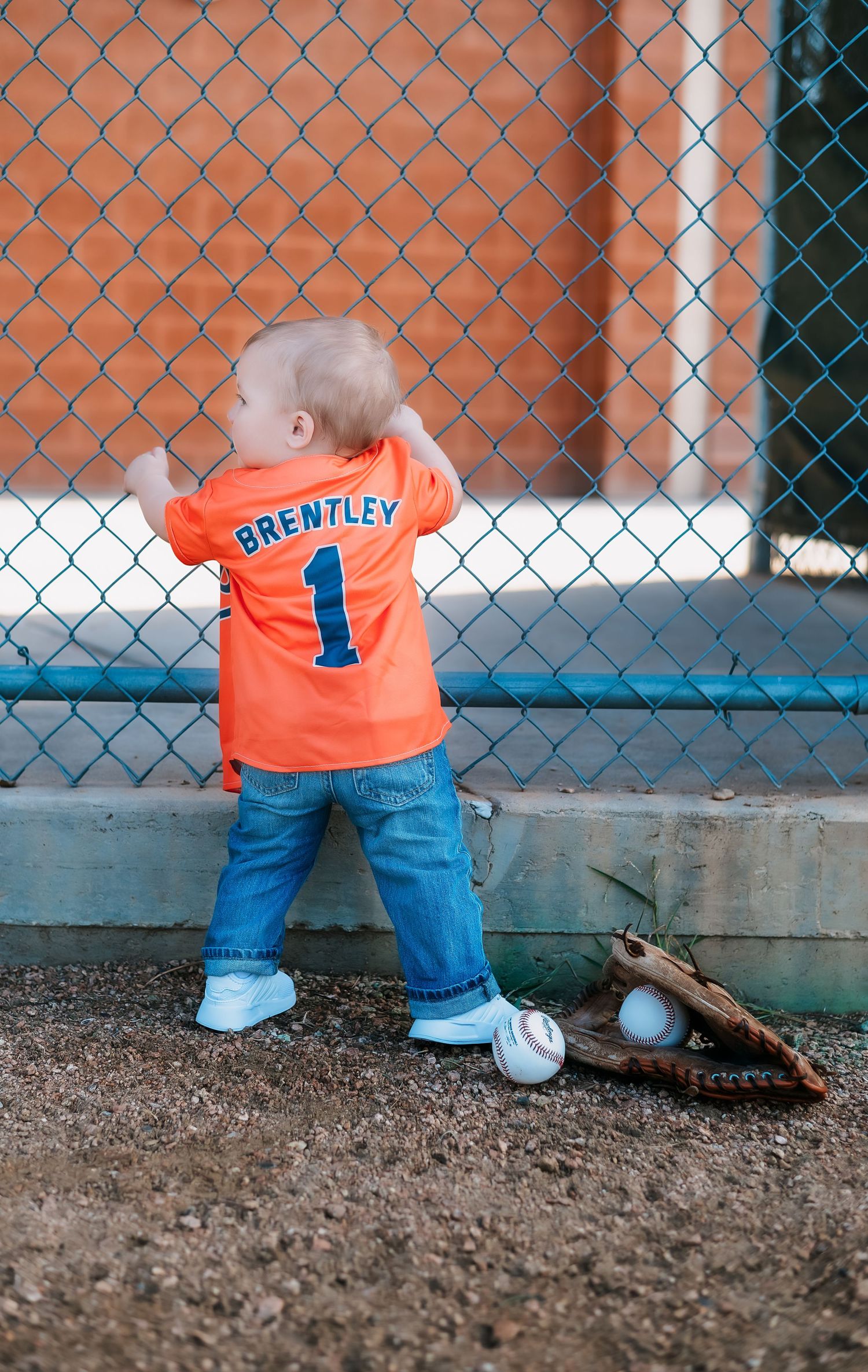 Baseball field photos featuring orange jersey and catcher's equipment against chain link fence.