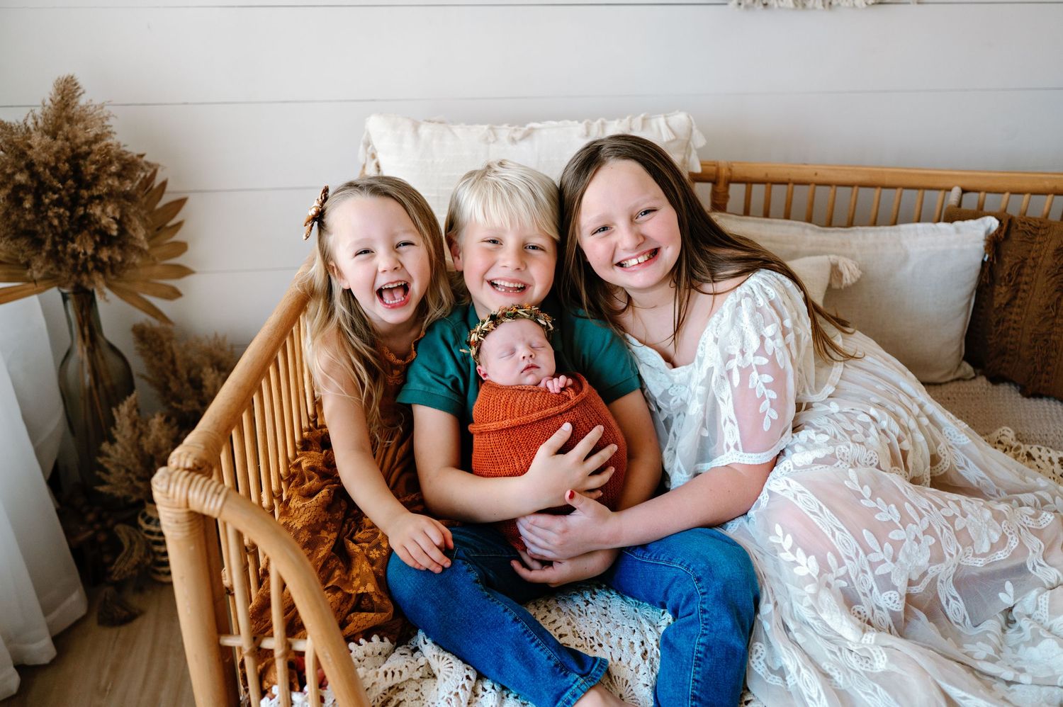 A collage of four candid family photos showing siblings and parents cuddling together on beds and couches.