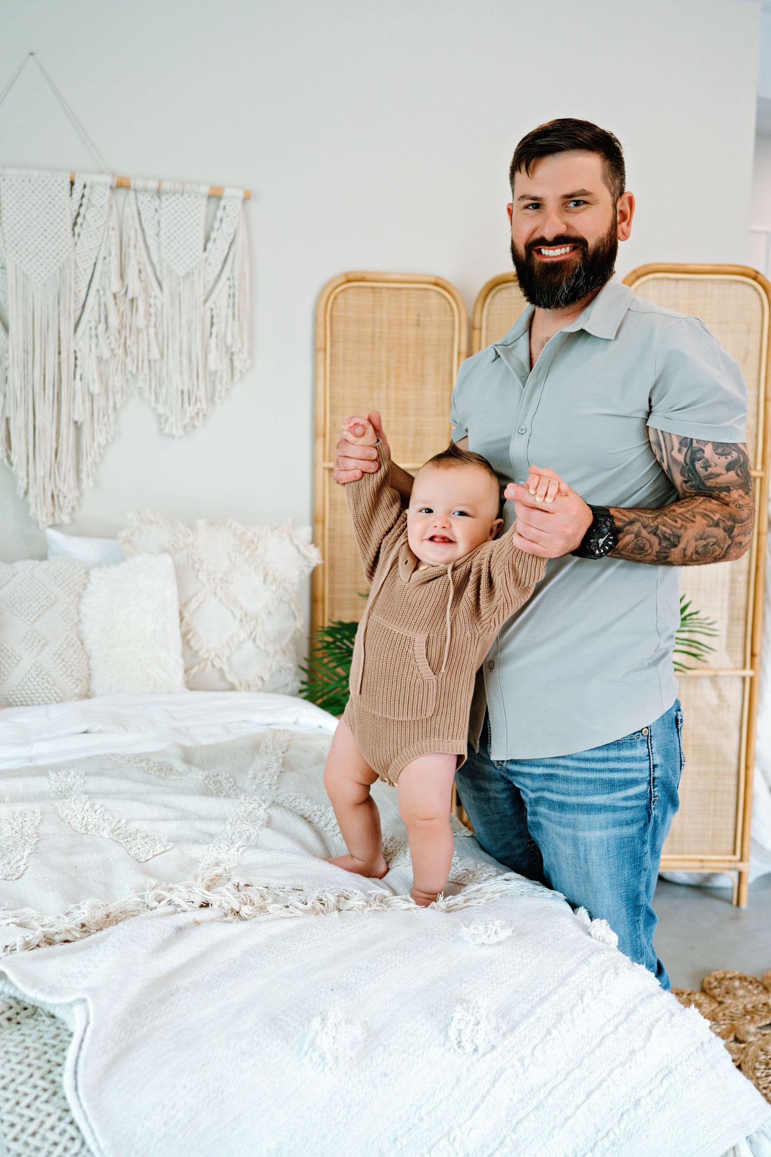 A series of playful moments captured on a white bed with rattan headboard in a bright, airy bedroom setting.