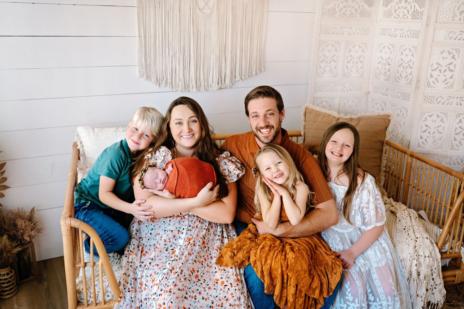 A series of family portrait photos showing people sitting together on a couch in a living room setting.