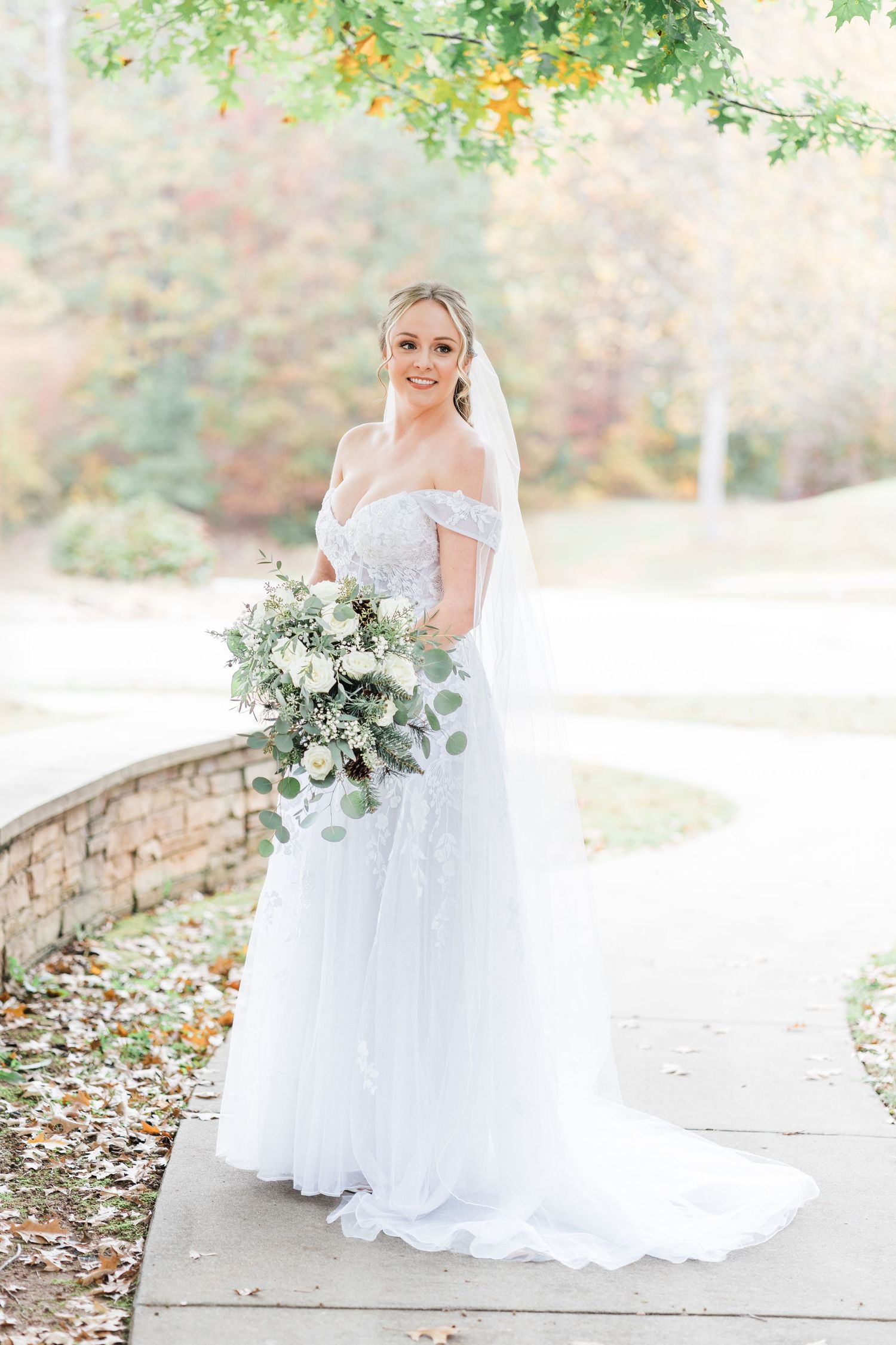 bride smiling and happy on the walkway at Camp Spearhead
