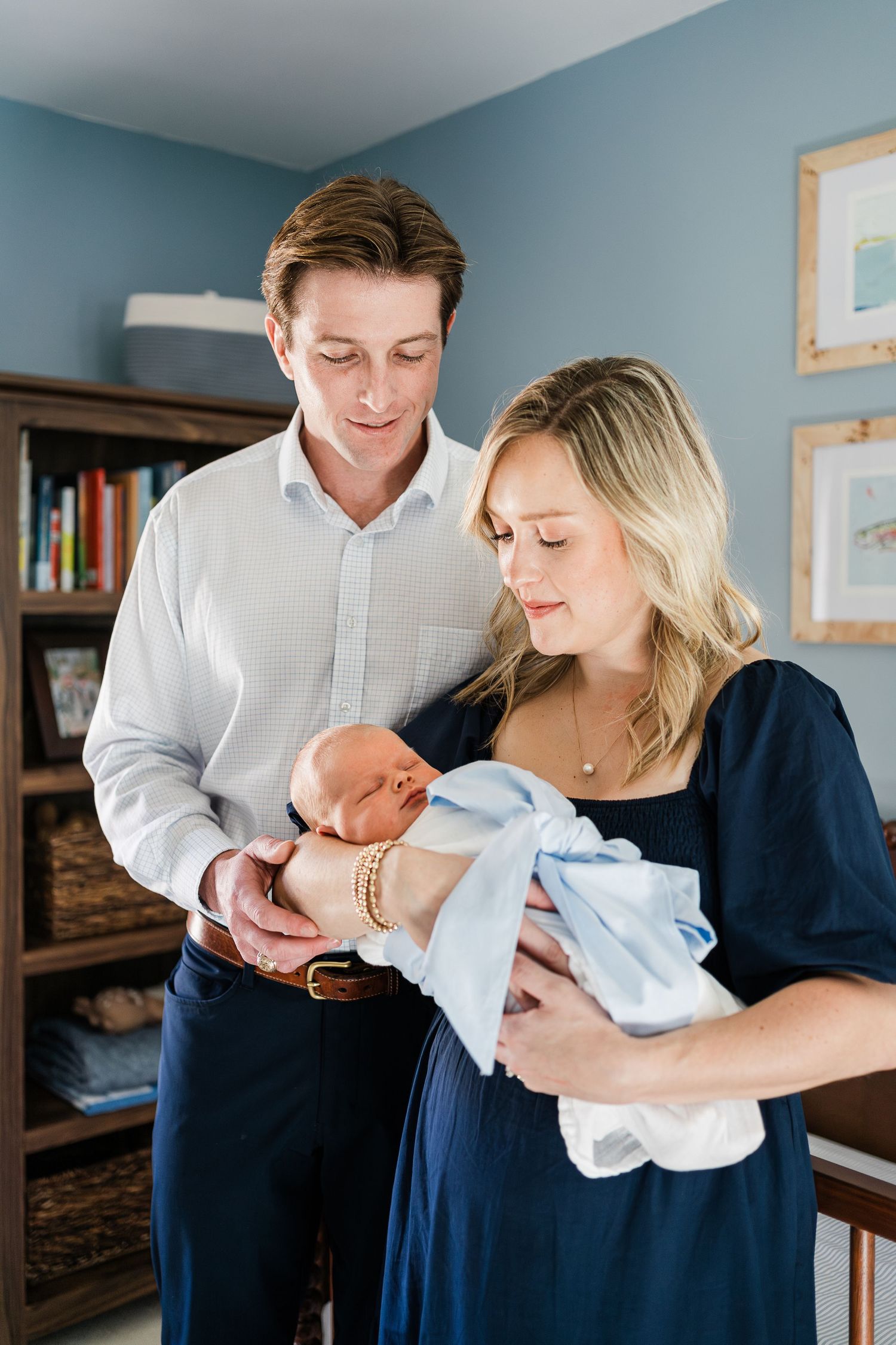 Close up of proud parents holding their new baby