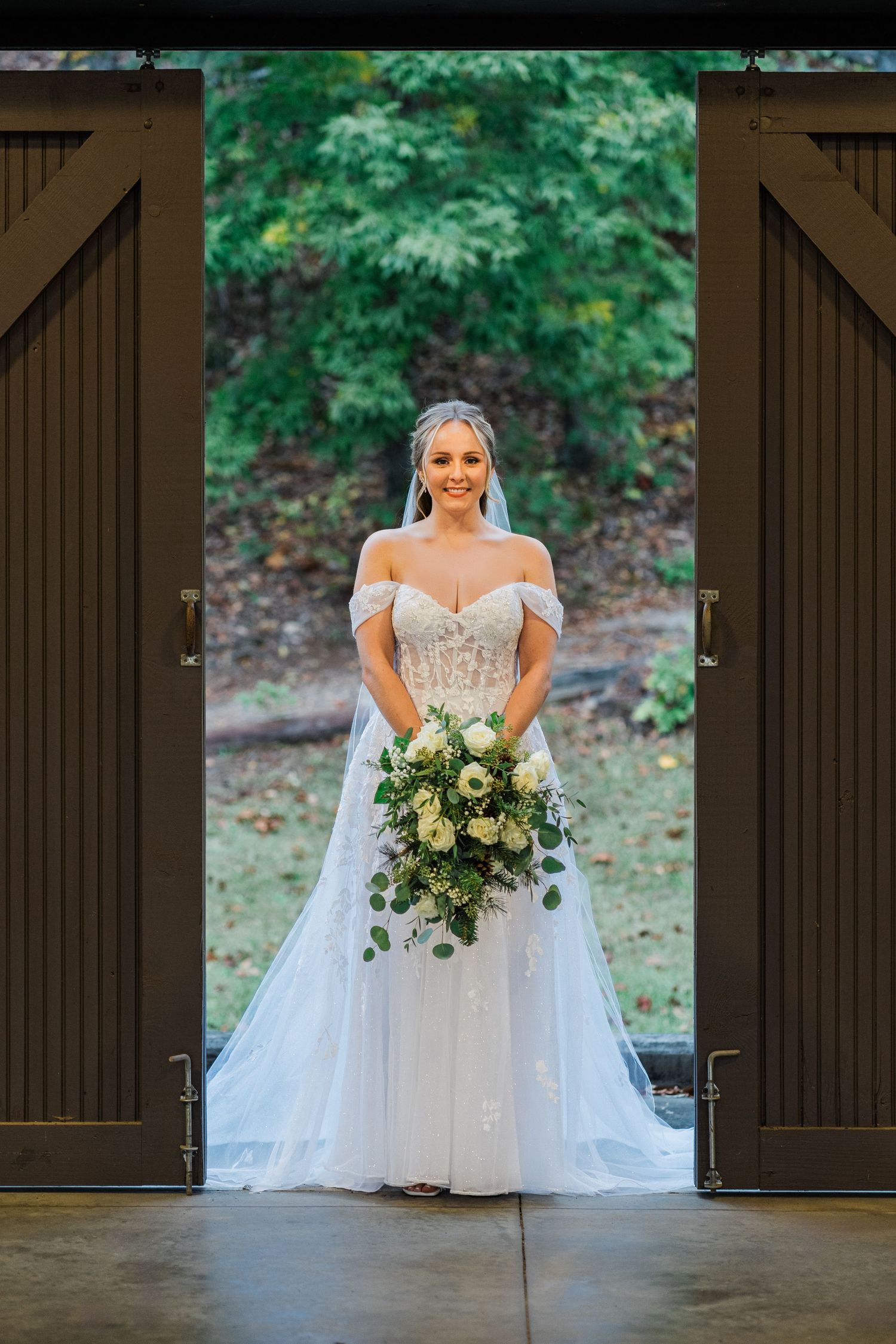 bride standing in the doorway of the amphitheater at Camp Spearhead