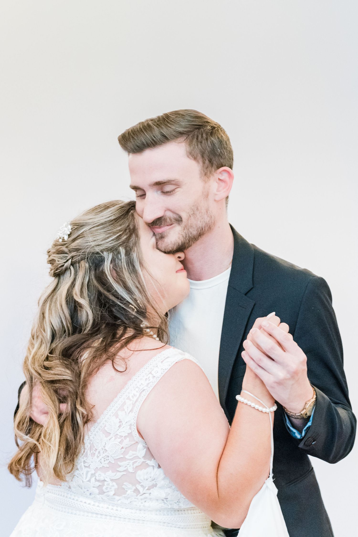 bride and her cousin dancing in honor of her late father