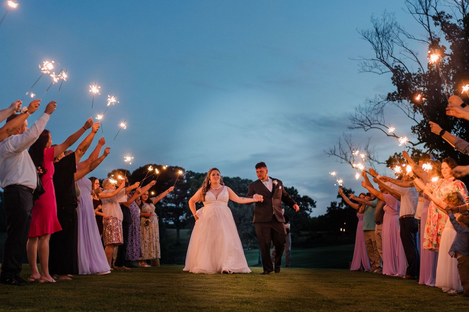 bride and groom leaving during the sparkler send off