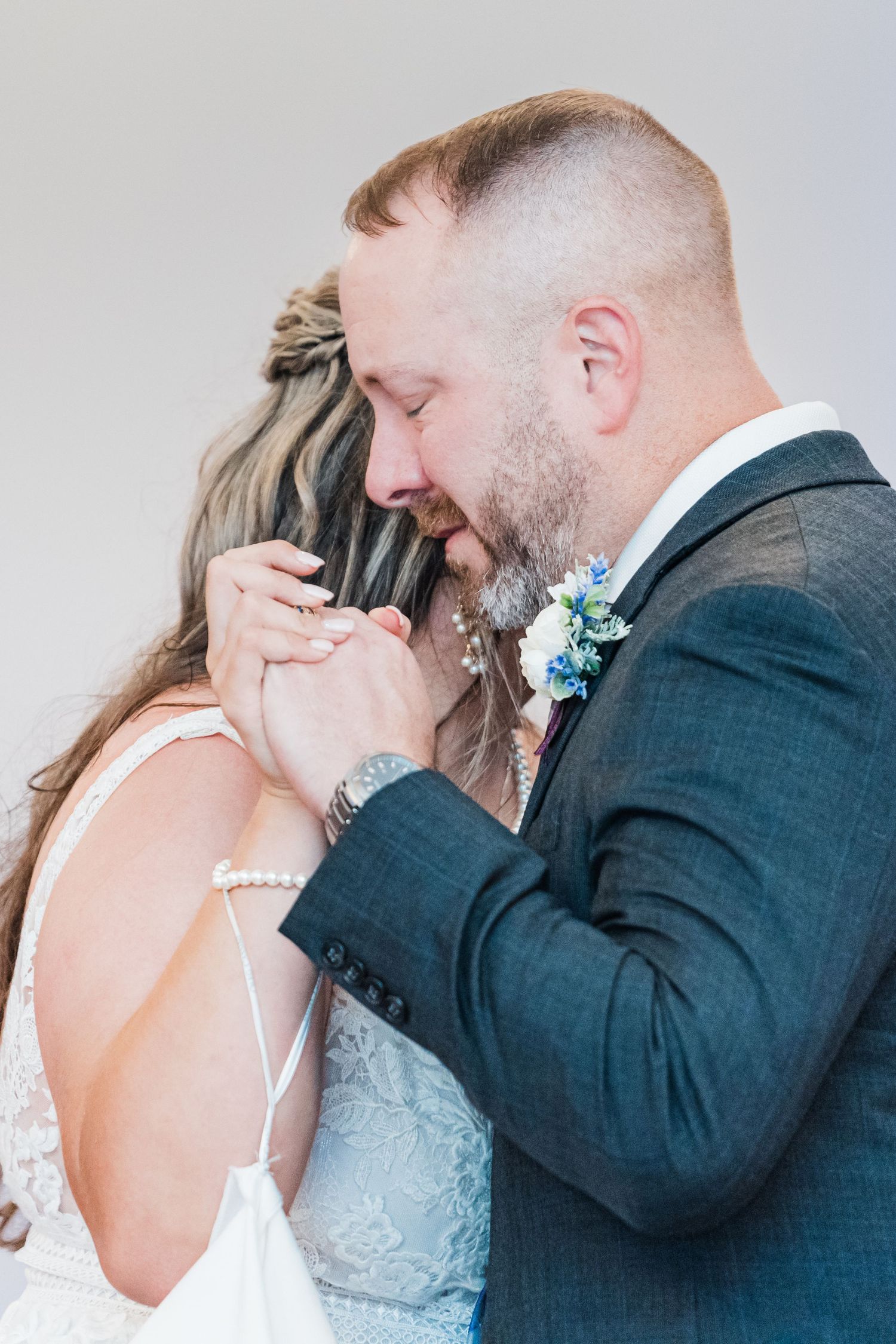 friend of the father-of-the-bride dancing and crying in honor of the bride's father