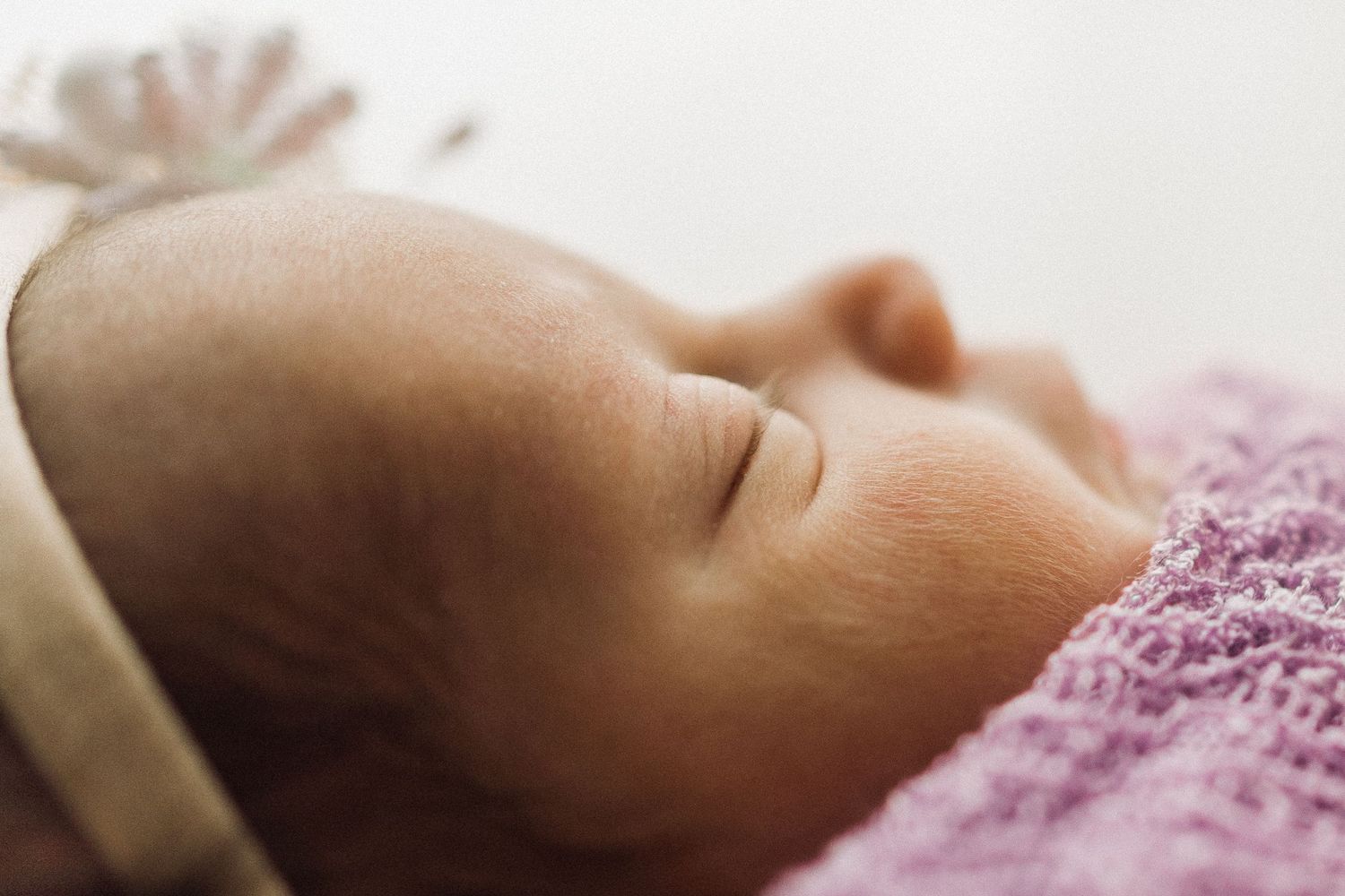 Close up of baby girl in soft natural light in Greenville SC home