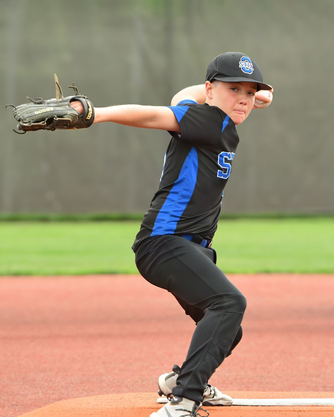 Baseball player pitching a ball