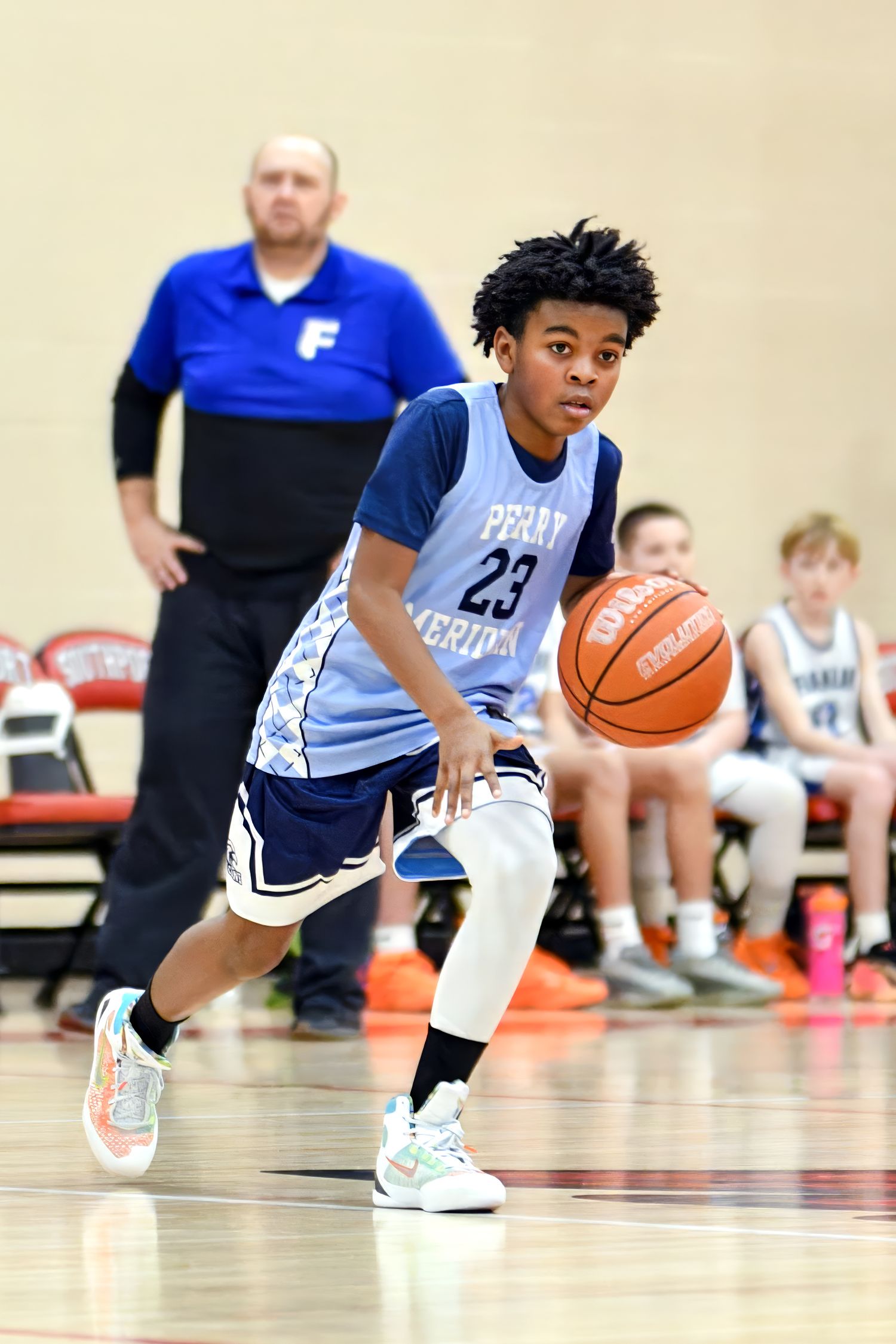 Youth male playing in a basketball game