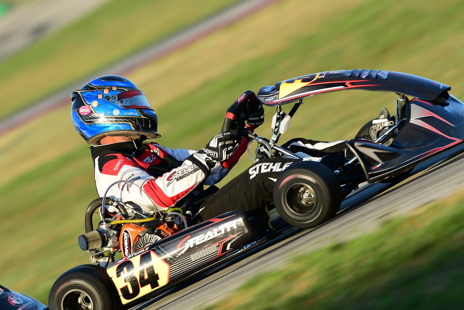 Professional gokart driver racing on a track