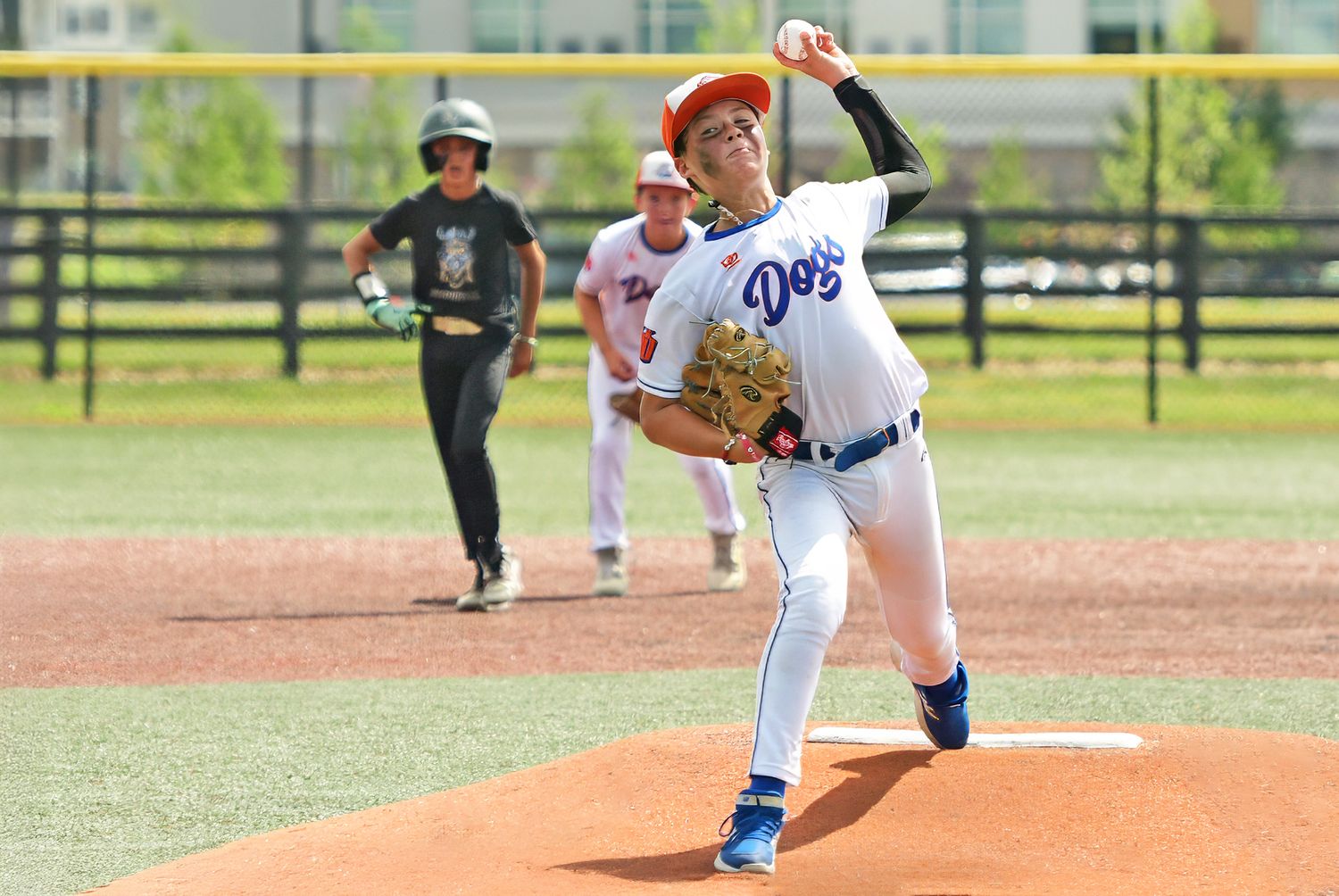 Pitcher on the mound mid-pitch