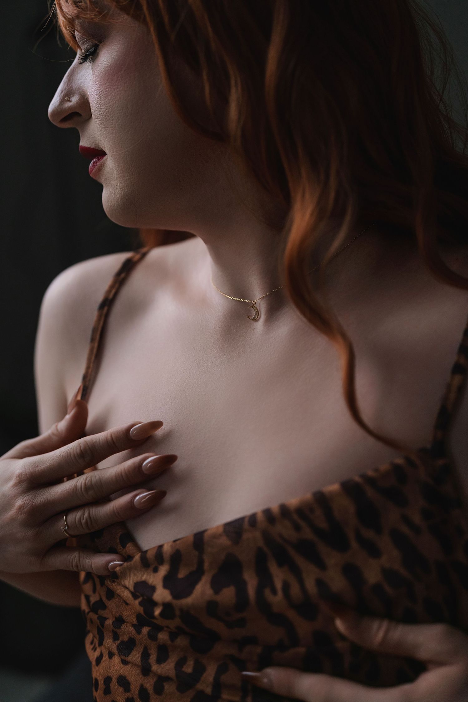 Close-up shot showing delicate neckline detail of leopard print dress.