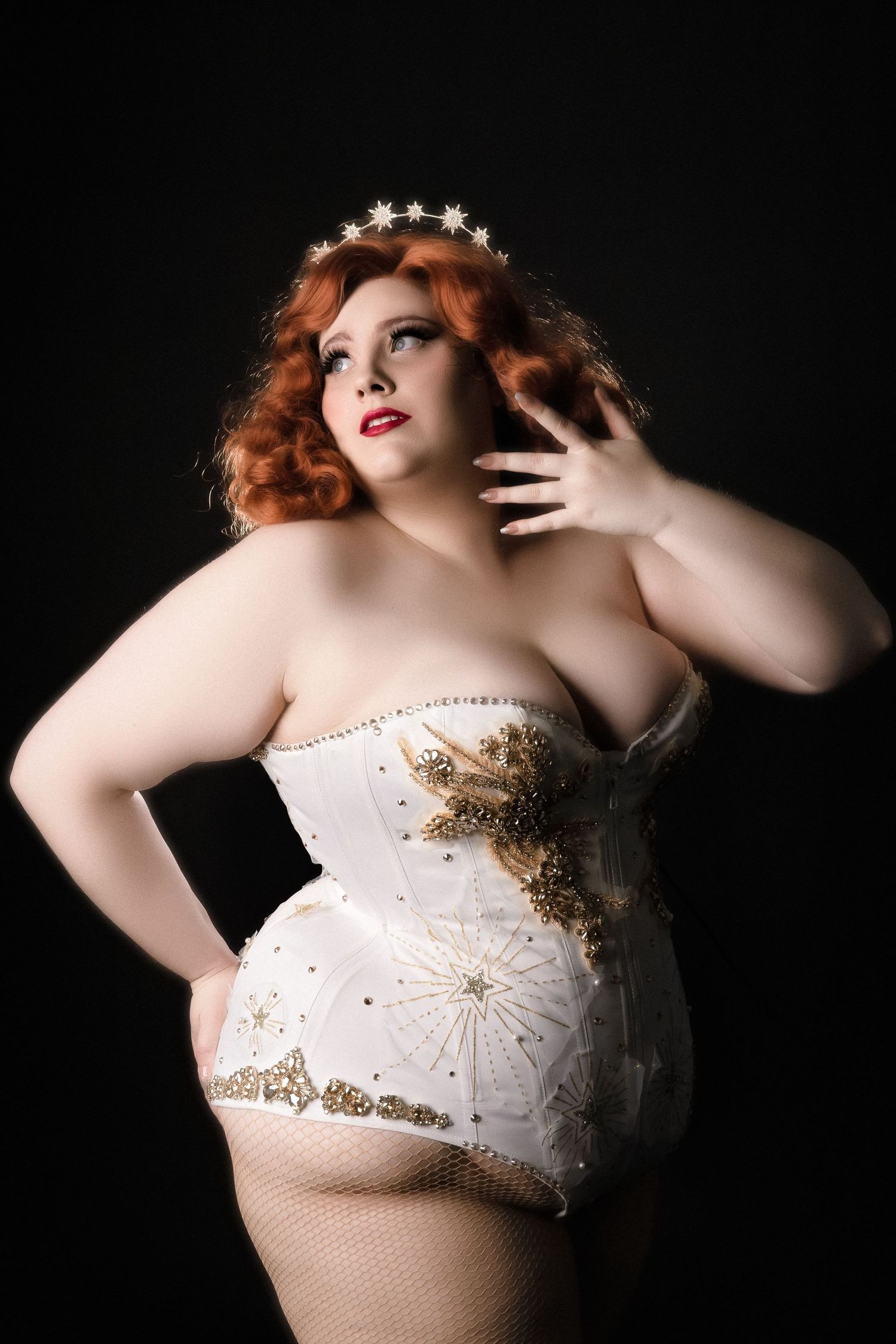 Glamorous white sequined corset with star crown accent.