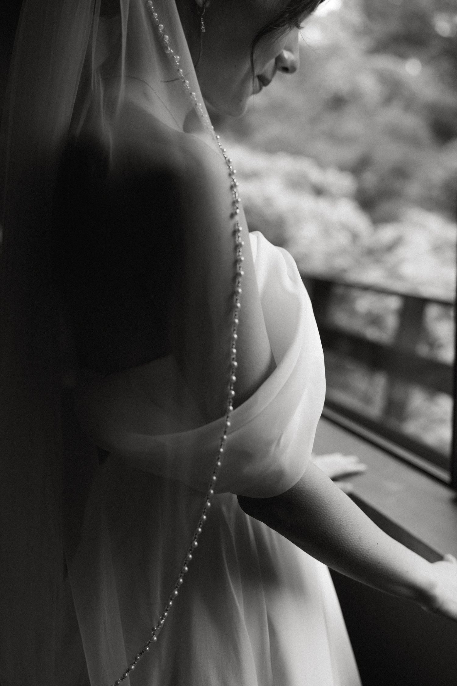 Close-up detail of delicate beading on a wedding dress veil.