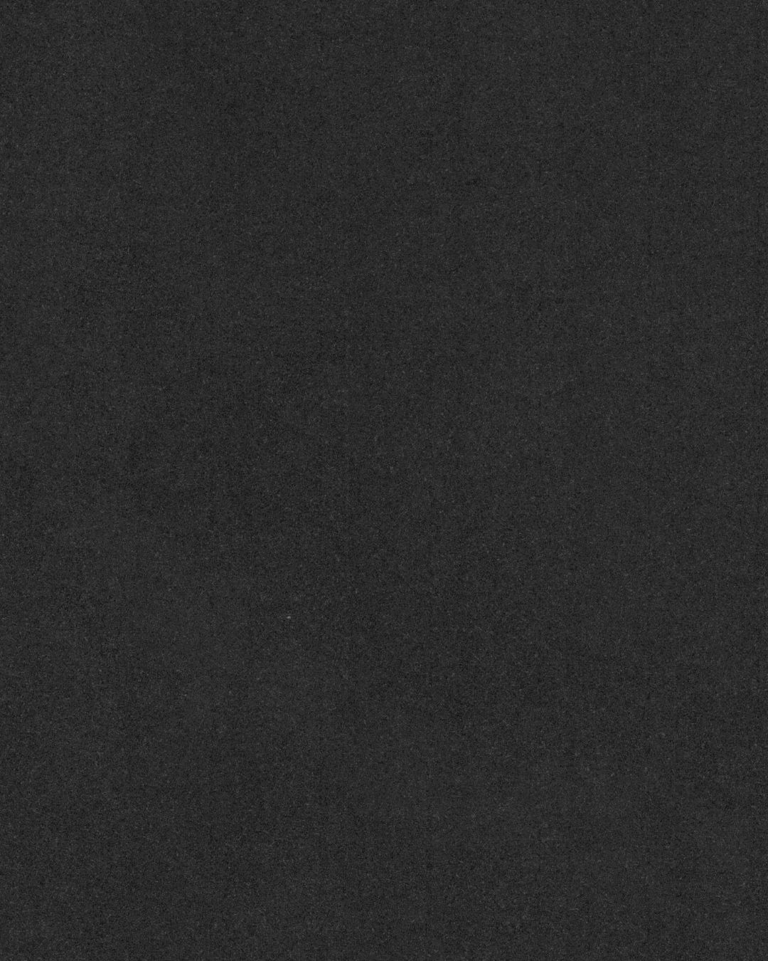 Dark textured background with deep black tones and subtle gradient.