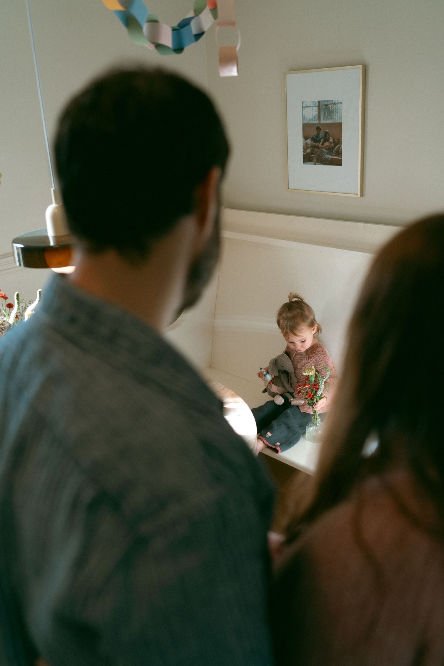 Sequence of intimate moments captured in a dimly lit room showing tender interaction between two people.